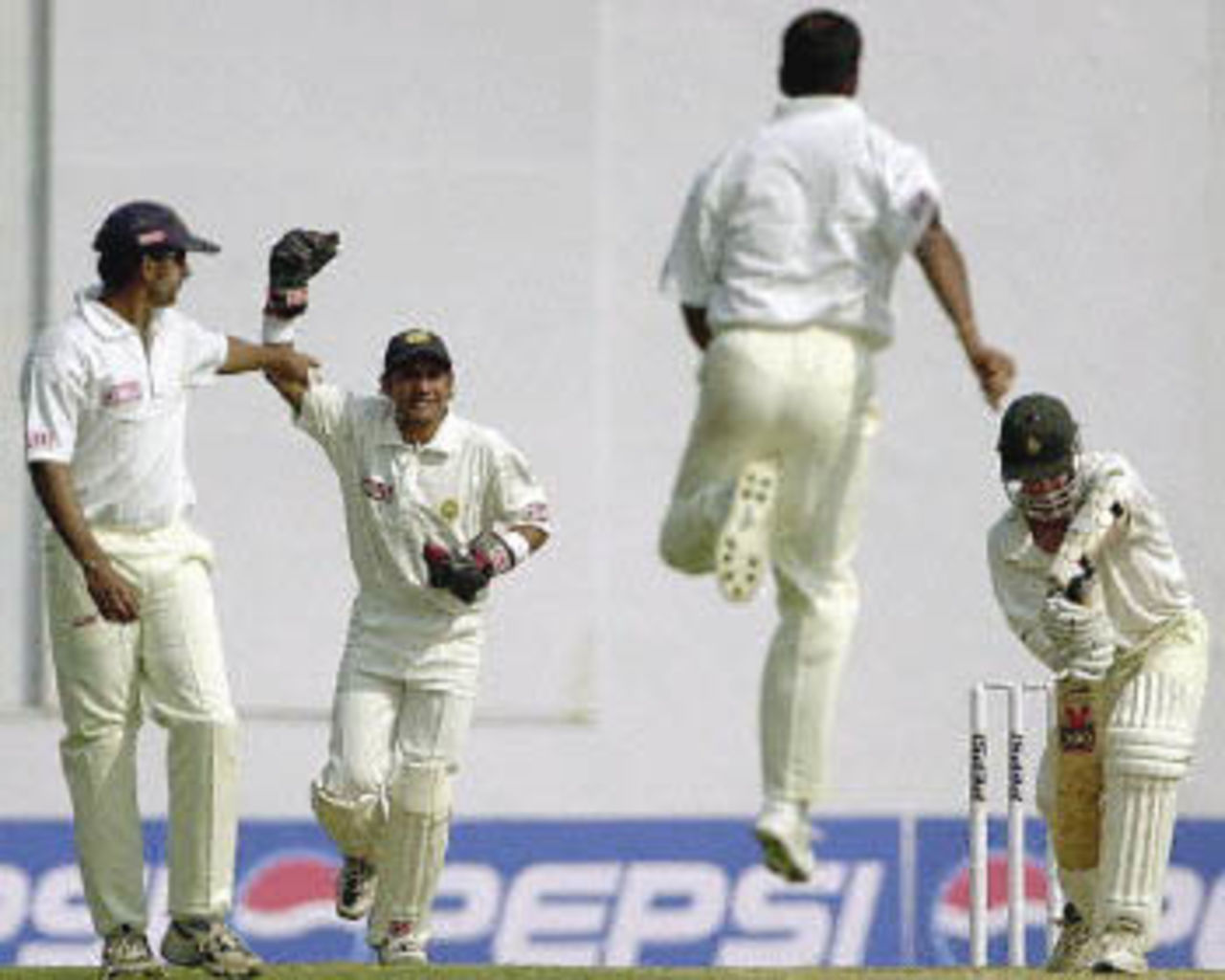 Joshi leaps in the air as he dismisses Grant Flower, Zimbabwe in India, 2000/01, 2nd Test, India v Zimbabwe, Vidarbha C.A. Ground, Nagpur, 25-29 November 2000 (Day 5).