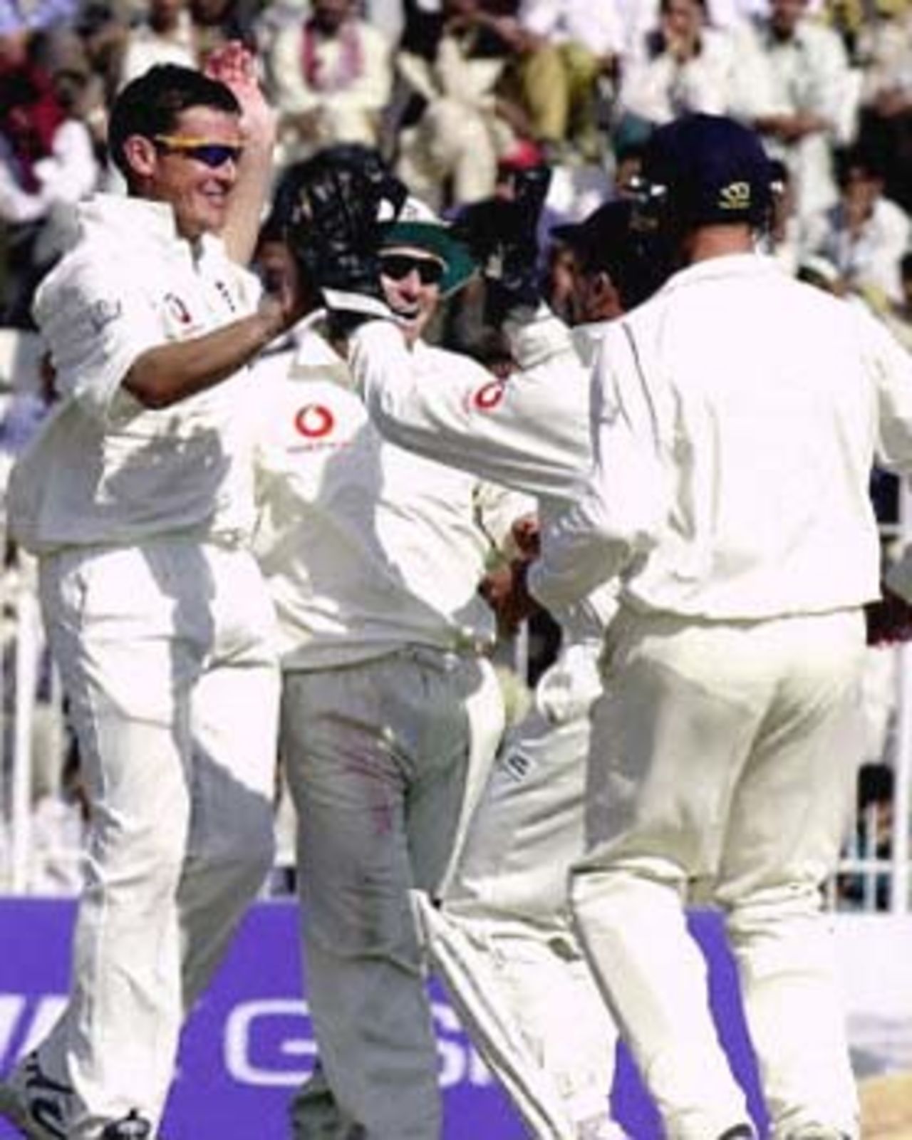 Ashley Giles being congratulated by his team mates after his second dismissal, England in Pakistan, 2000/01, 2nd Test, Pakistan v England, Iqbal Stadium, Faisalabad, 29Nov-03Dec 2000 (Day 1).
