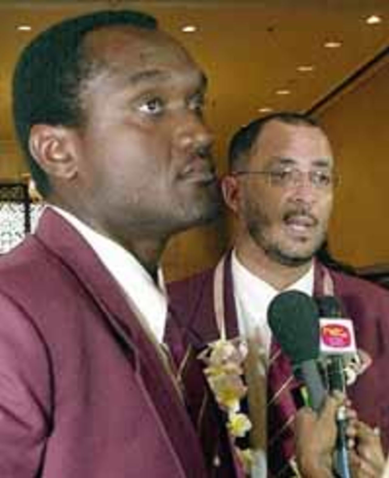 Captain Hooper (left) and Manager Skerritt on the right being interviewed upon arrival in Sri Lanka