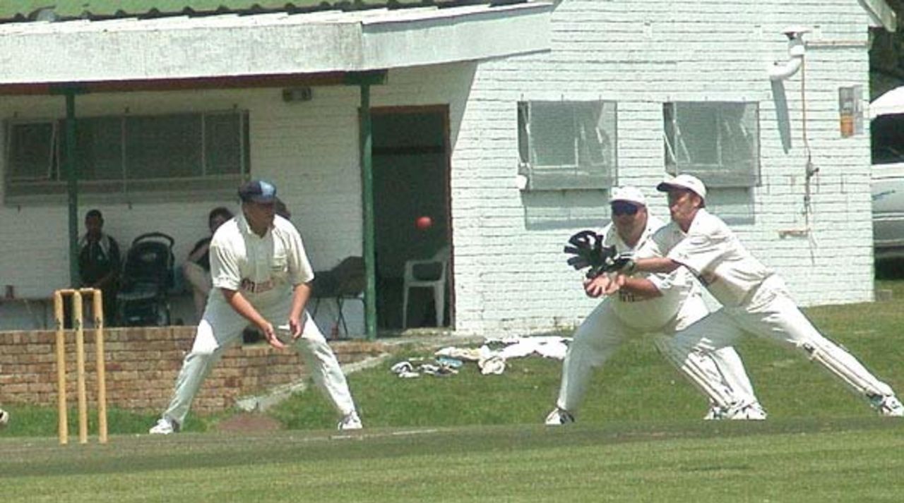 Somerset West wicketkeeper Hilton Traut moves smartly to his right to bag a catch off the bowling of John Hartley. The first slip is Lesley Morkel. Second slip is MS Willwmse.
