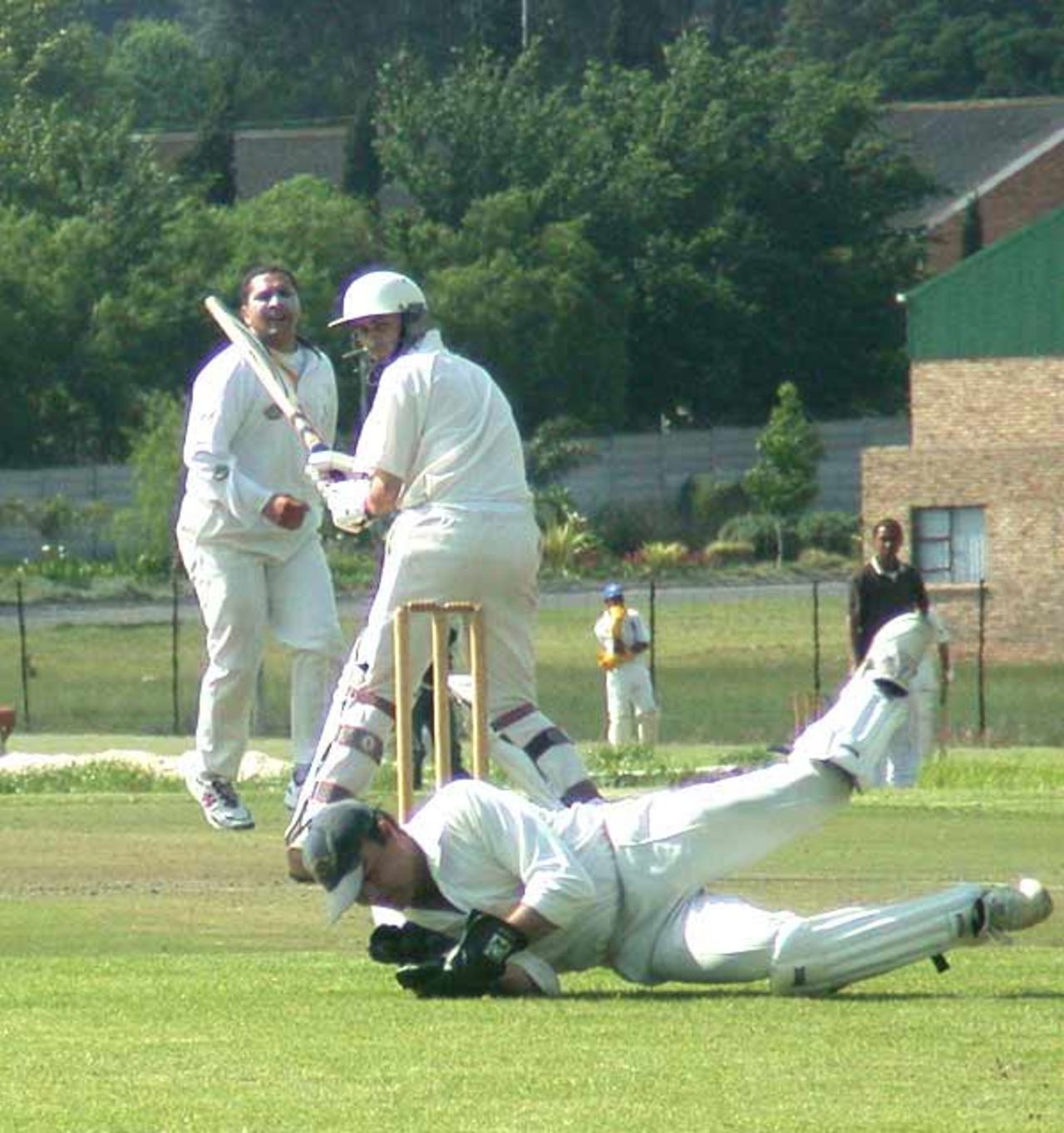 Somerset west opening bat Jeremy Rankin attempts a leg glance as Durbanville wicketkeeper De Vries Basson dives to cut off the ball off the bowling of Lilian de Silva.