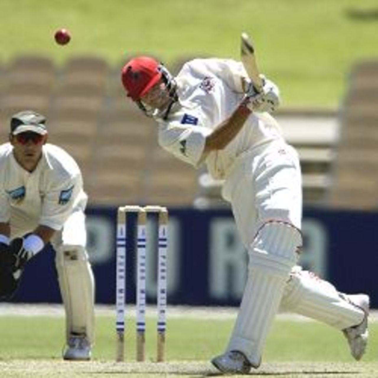 16 Nov 2001: Greg Blewett of South Australia drives New Zealand bowler Darryl Tuffey in the match between South Australia and New Zealand played at the Adelaide Oval in Adelaide, Australia.