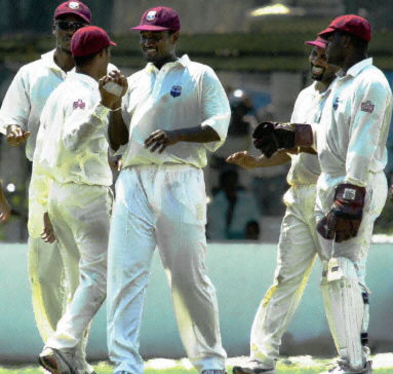 Carl Hooper celebrates with teammates after taking the wicket of Sri Lankan batsman Russel Arnold