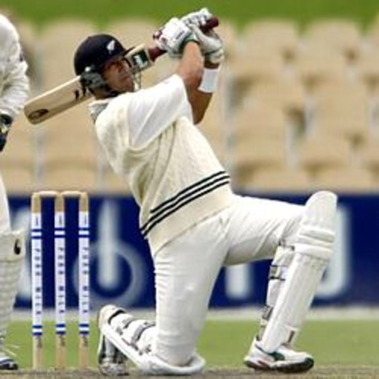 18 Nov 2001: Darryl Tuffey of New Zealand drives Peter McIntyre for 4 on his way to 56 in the match between South Australia and New Zealand played at Adelaide Oval in Adelaide, Australia.