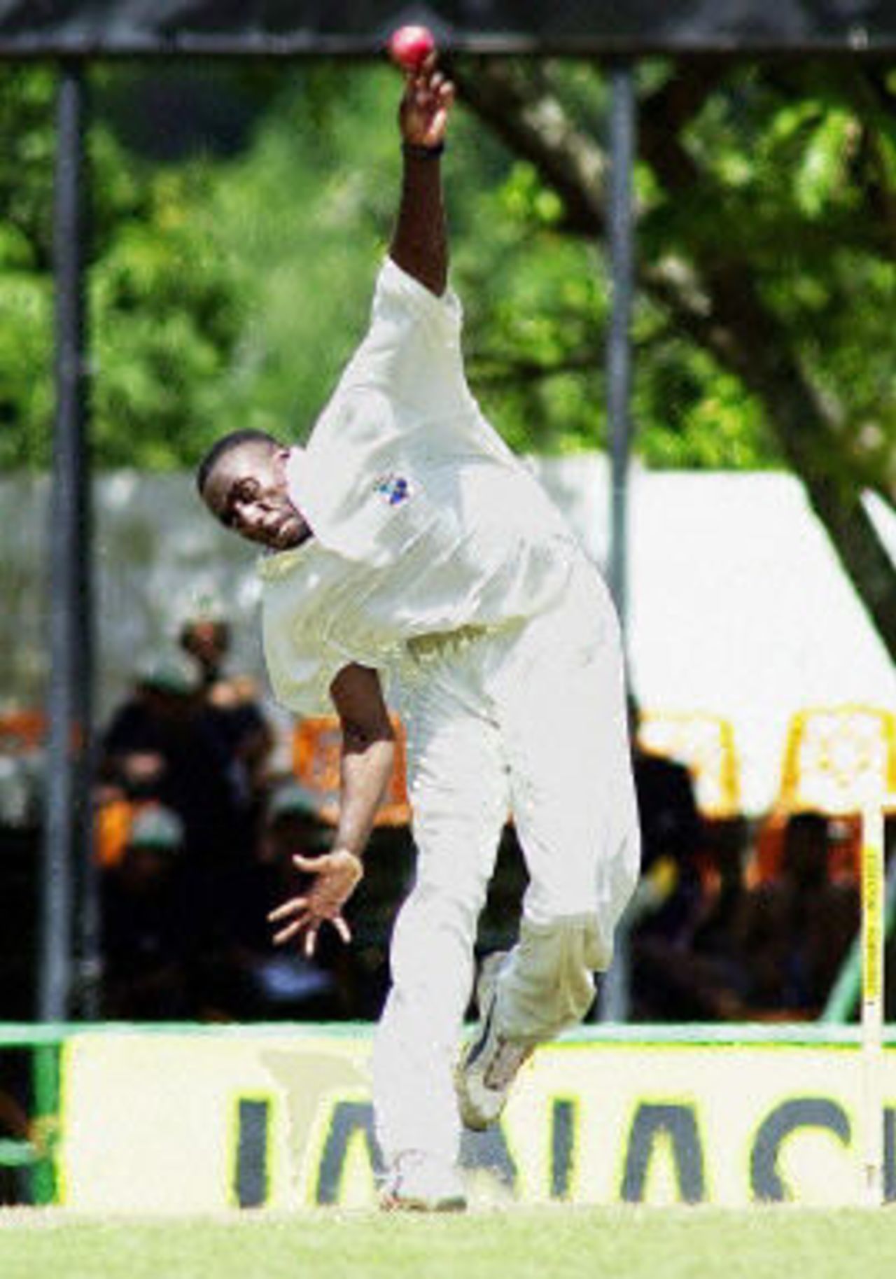 Pedro Collins delivers a ball during the first day of the second Test match between Sri Lanka and West Indies at Asgiriya Stadium in Kandy