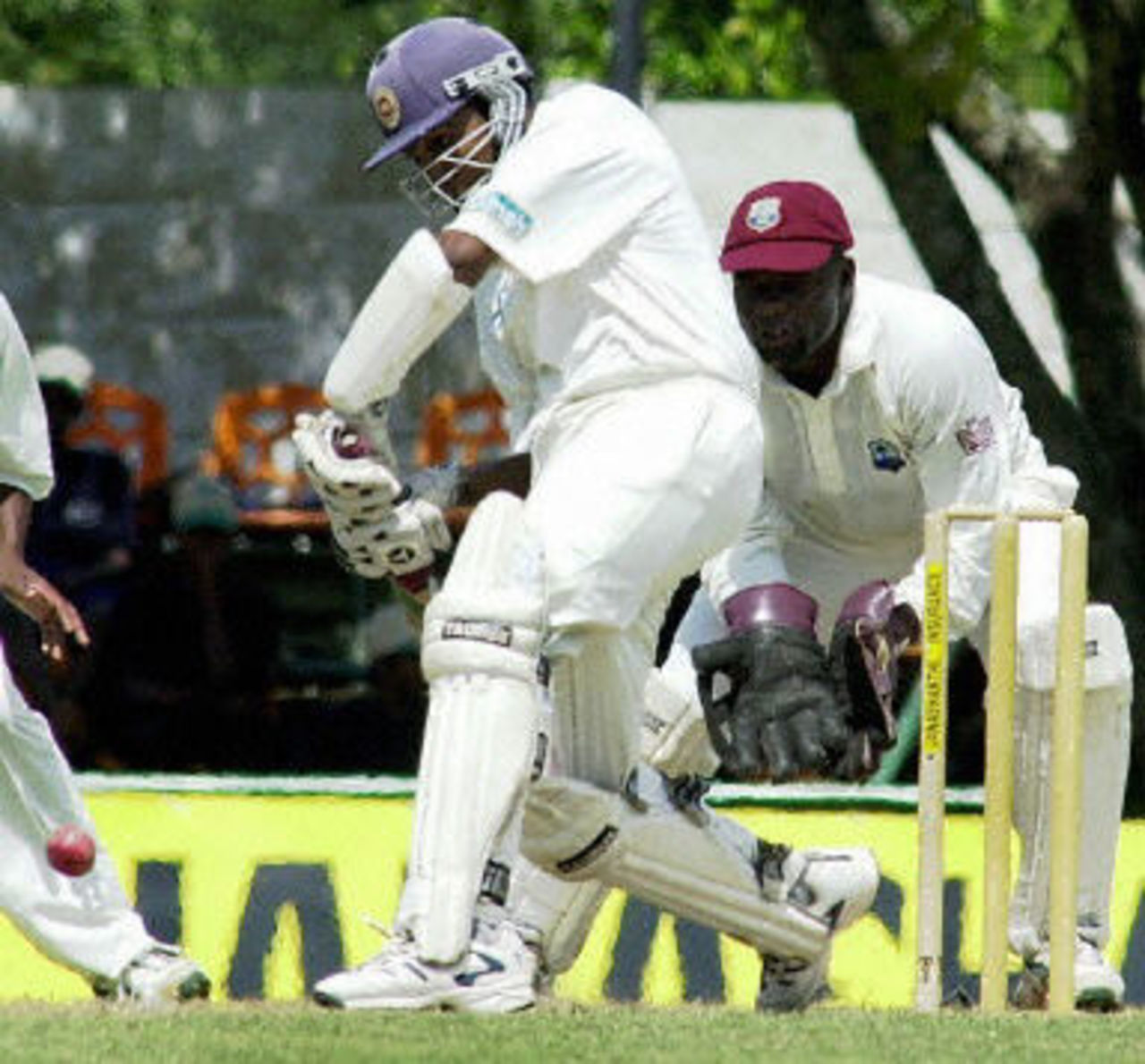Mahela Jayawardene drives a ball as West Indies wicketkeeper Ridley Jacobs looks on