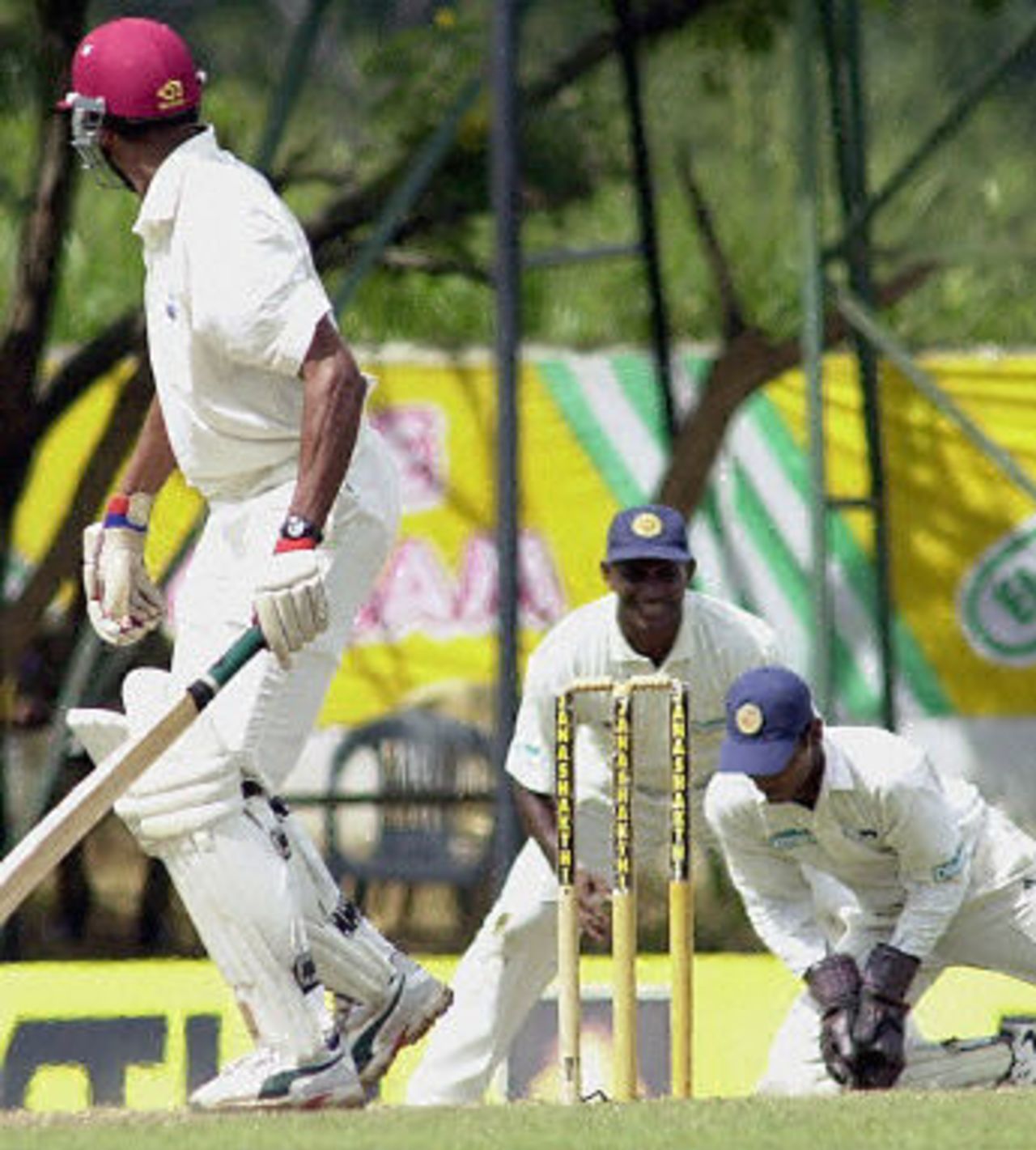 Mervyn Dillon looks back as Kumar Sangakkara holds a catch