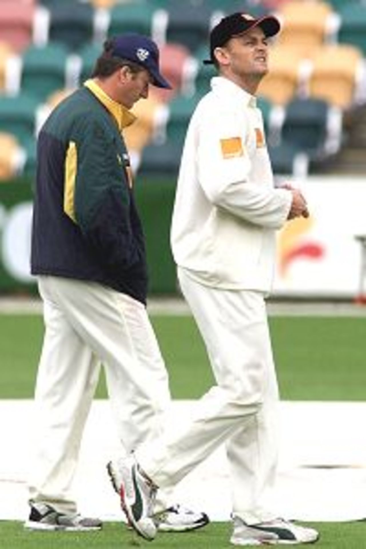 26 Nov 2001: Steve Waugh and Adam Gilchrist of Australia inspect the ground shortly before the match was abandonned due to poor weather, during day five of the second test between Australia and New Zealand, played at Bellerive Oval, Hobart, Australia.