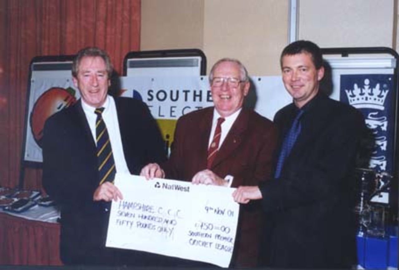 Hampshire chairman Rod Bransgrove (left) is pictured receiving a cheque for £750 from Neil Owen (Southern Electric Partnership Accounts manager and Jeff Levick (centre) who organised the sponsored walk.