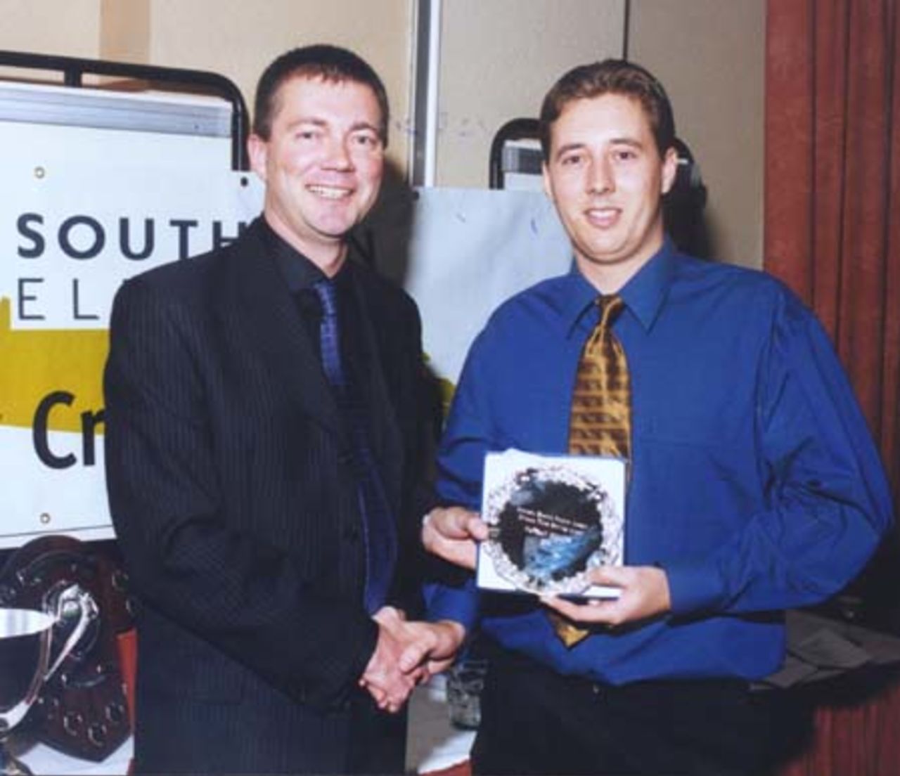 Neil Owen presents Nathan Collins with the Division III bowling award for 2001
