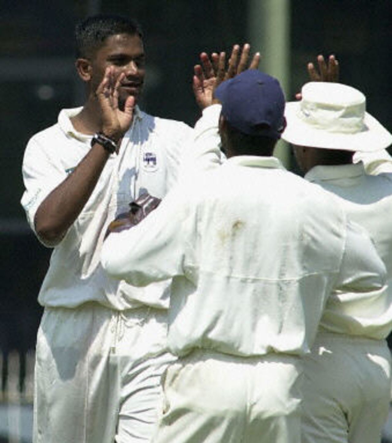 Nuwan Zoyza celebrates with teammates the dismissal of West Indies batsman Ridley Jacobs