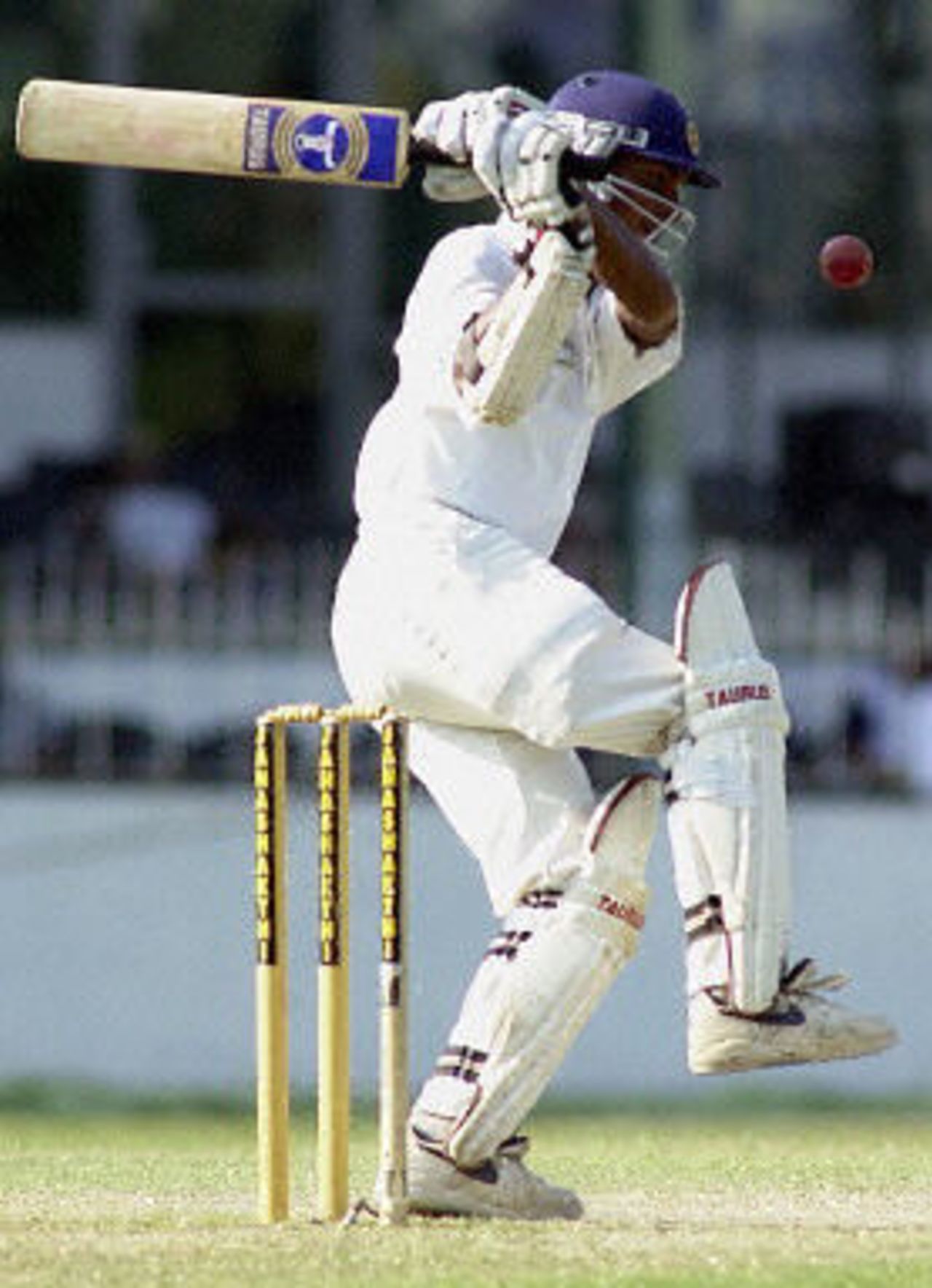 Kumar Sangakkara drives a ball to the boundary for four