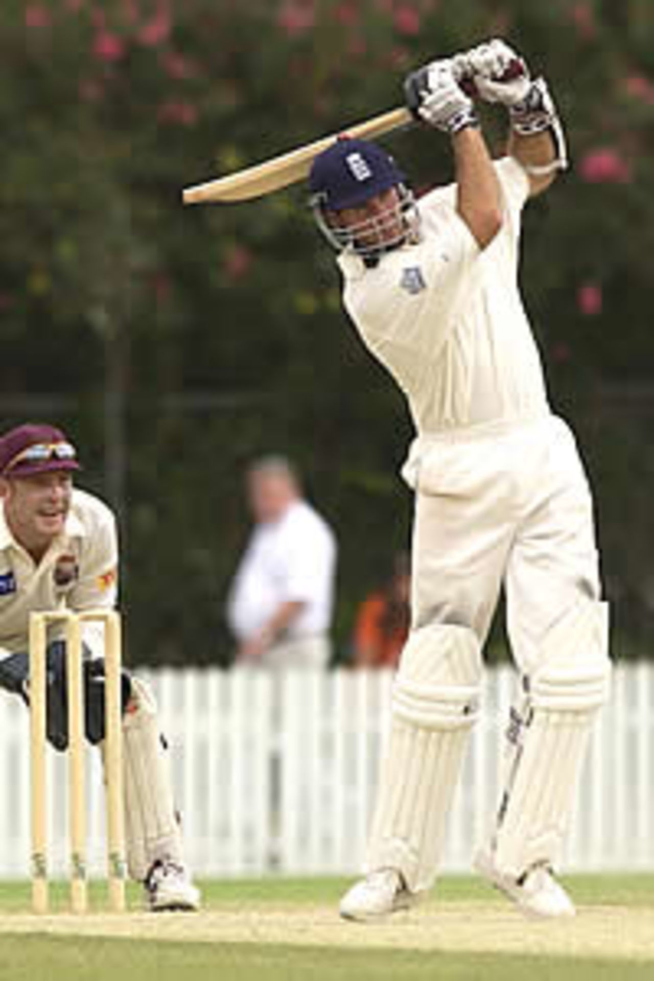 BRISBANE - NOVEMBER 4: Michael Vaughan of England hits out on his way to a century against Queensland during the three day tour match at the Allan Border Field cricket ground, Brisbane, Australia on November 4, 2002.