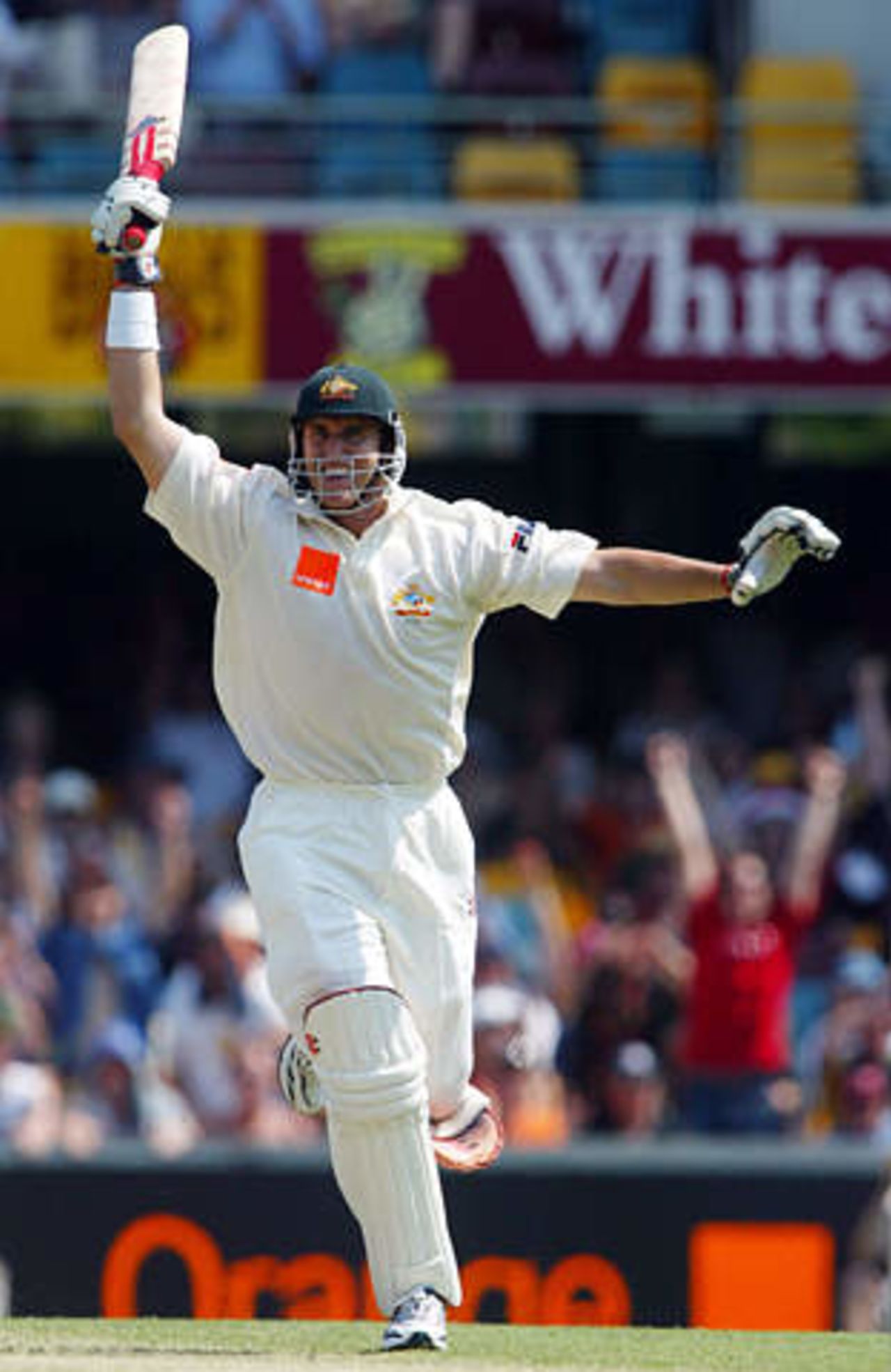 Australia's Matthew Hayden celebrates reaching his century during the first day's play in the first Ashes test match against England at the Gabba in Brisbane November 7, 2002.