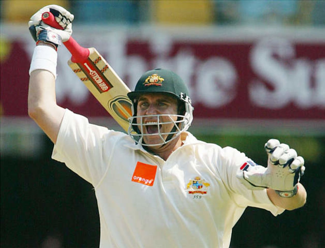 Australia's Matthew Hayden celebrates reaching his century during the first day's play in the first Ashes test match against England at the Gabba in Brisbane November 7, 2002.
