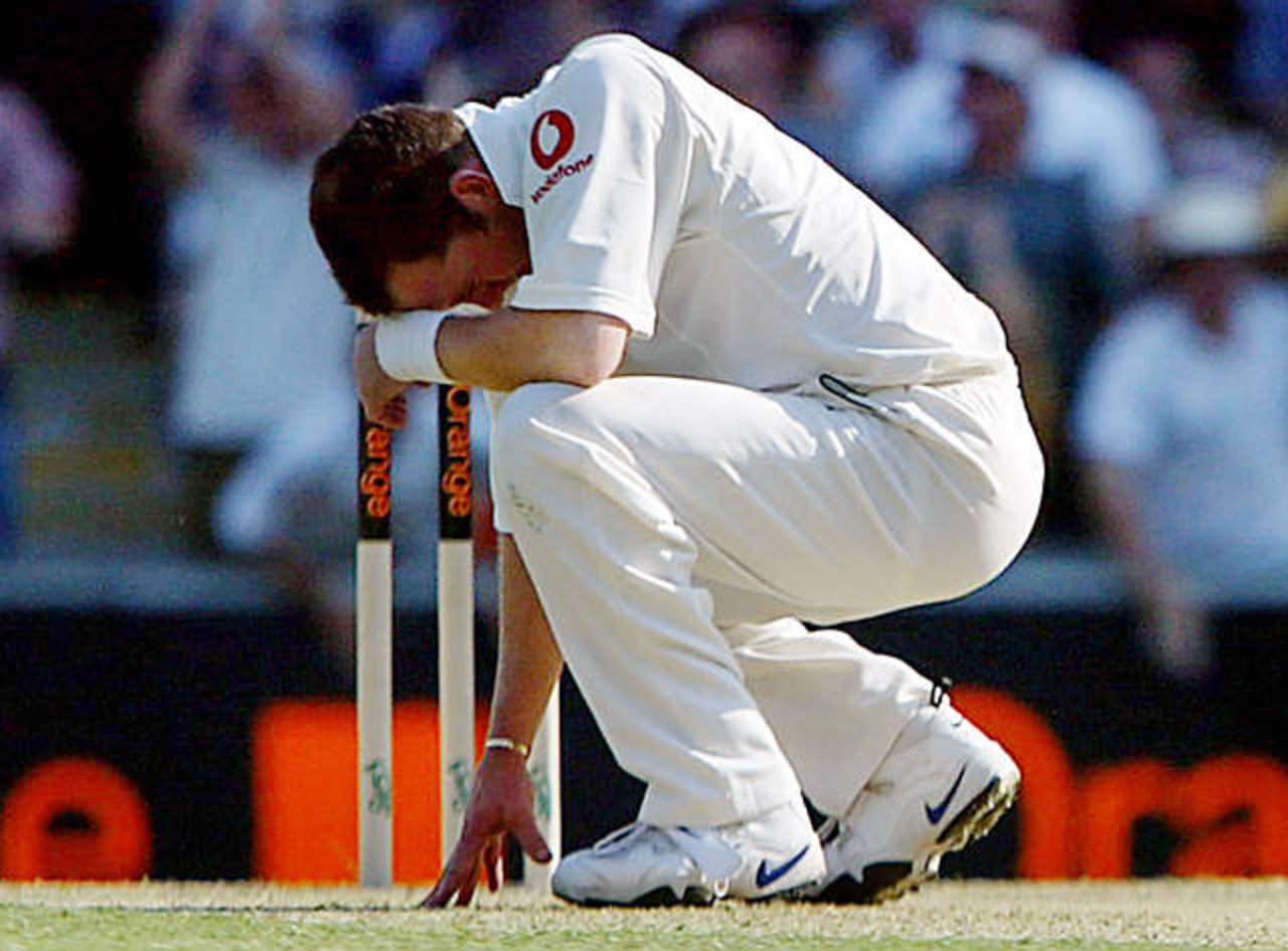 England's Craig White reacts after teammate Michael Vaughan dropped Australia's Matthew Hayden during the first day's play in the first Ashes test match at the Gabba in Brisbane November 7, 2002.