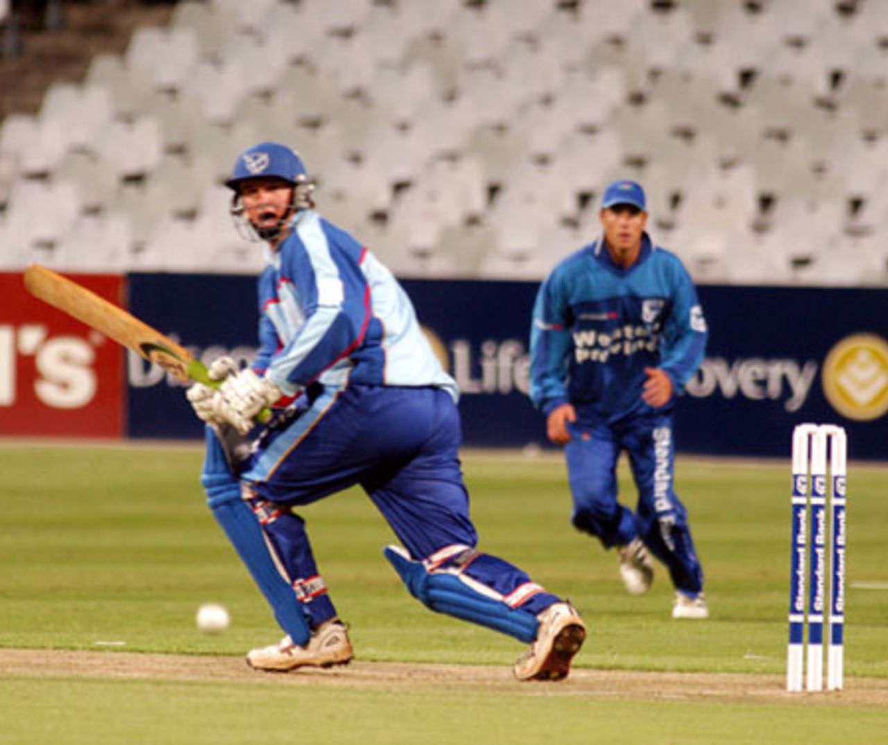 J-B Burger plays to the legside with Jonathan McLean looking on