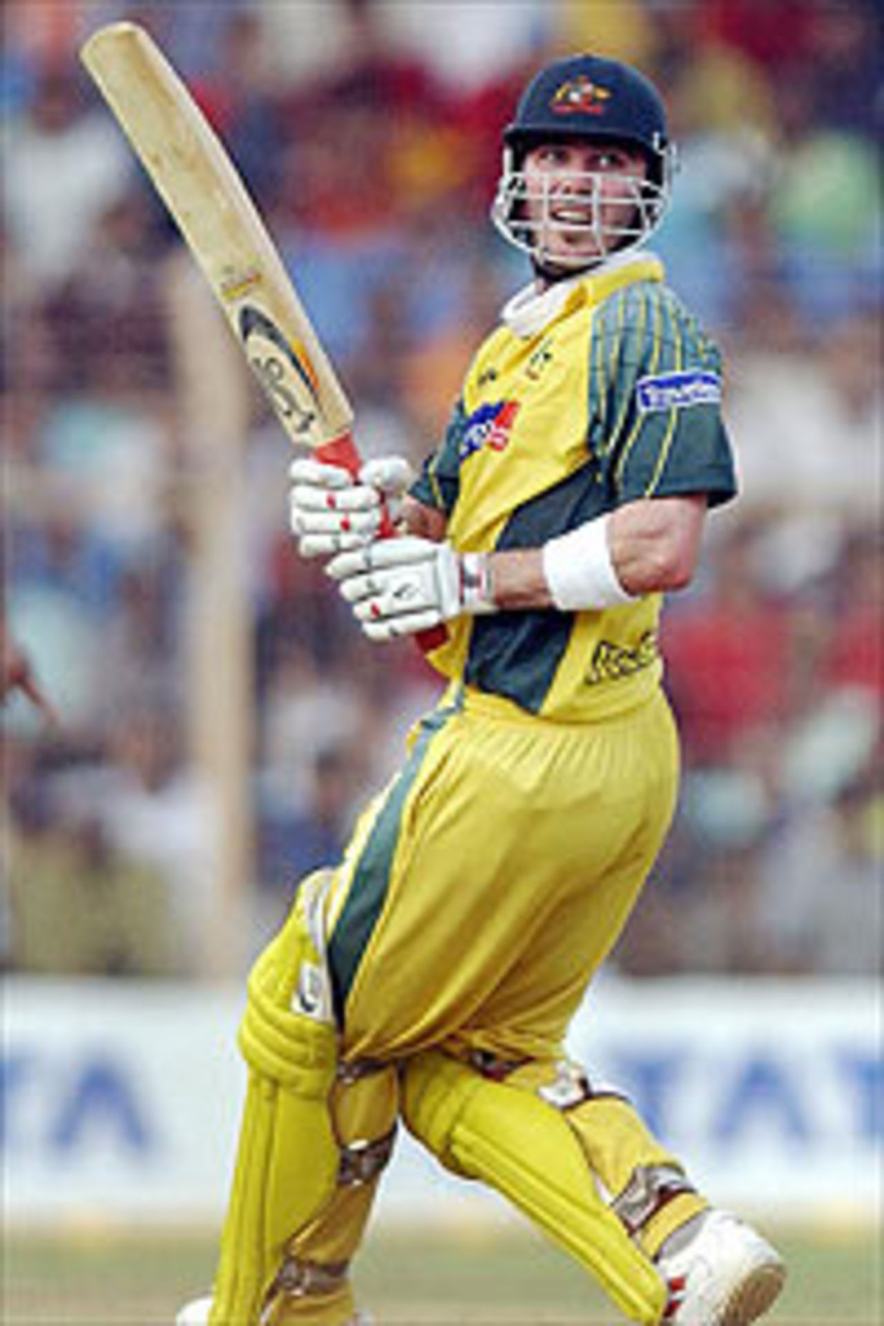 Australian batsman Damien Martyn looks back after nicking a delivery off Indian bowler Anil Kumble for a boundary taking his score to 95 during a TVS tri-series day-night game between India and Australia.at the Wankhade Stadium, Bombay, 01 November 2003.