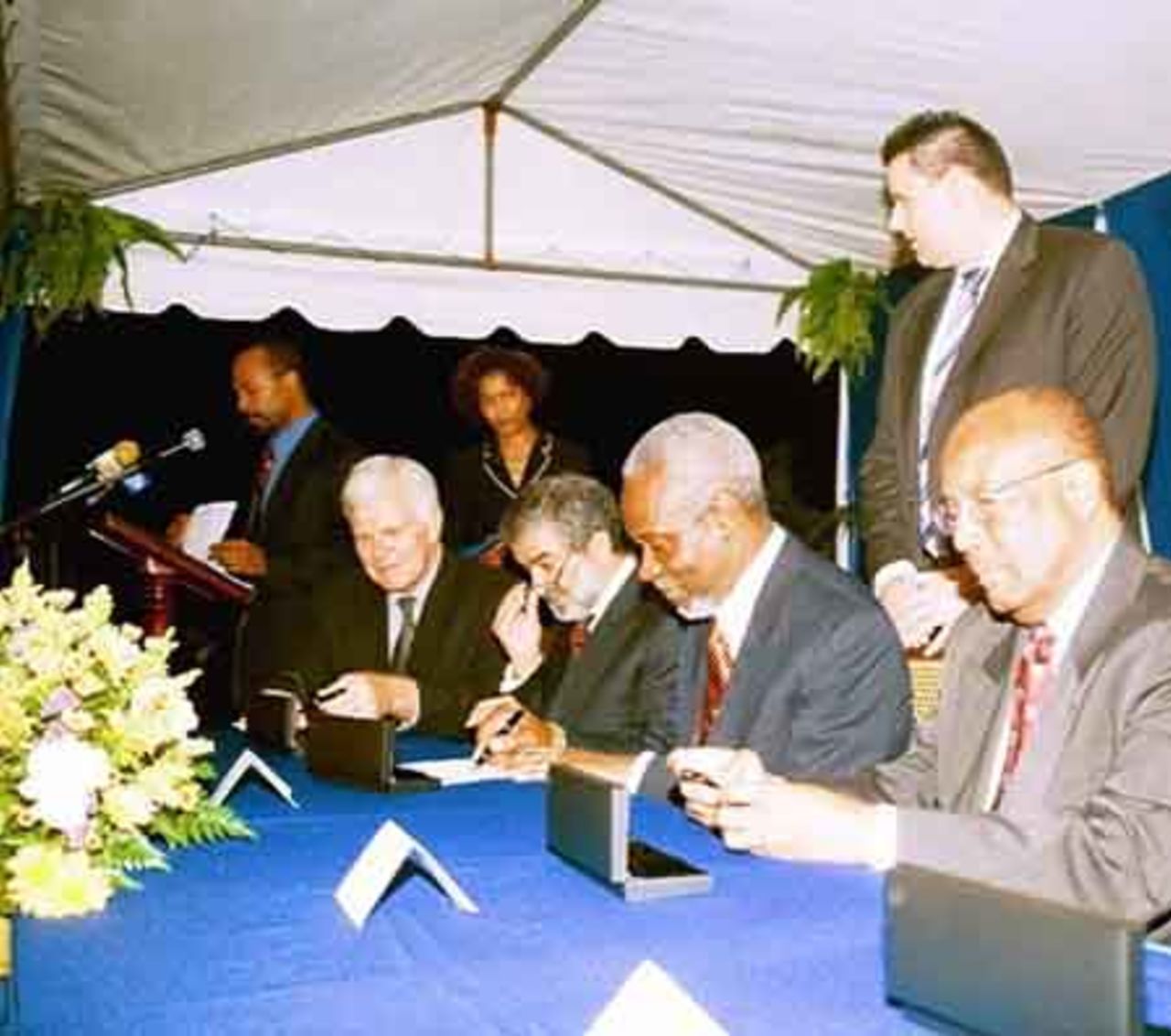 (At table) Prime Minister of Jamaica and Chairman of the Conference of Heads of Government for CARICOM, PJ Patterson (second from right) signs the Host Agreement formally establishing the partnership between the International Cricket Council (ICC) and the WICB for the ICC Cricket World Cup 2007 while President of the ICC, Ehsan Mani (second left) signs on behalf of the ICC. The signing was witnessed by ICC CEO Malcolm Speed (first from left) and WICB President, Teddy Griffith (right).