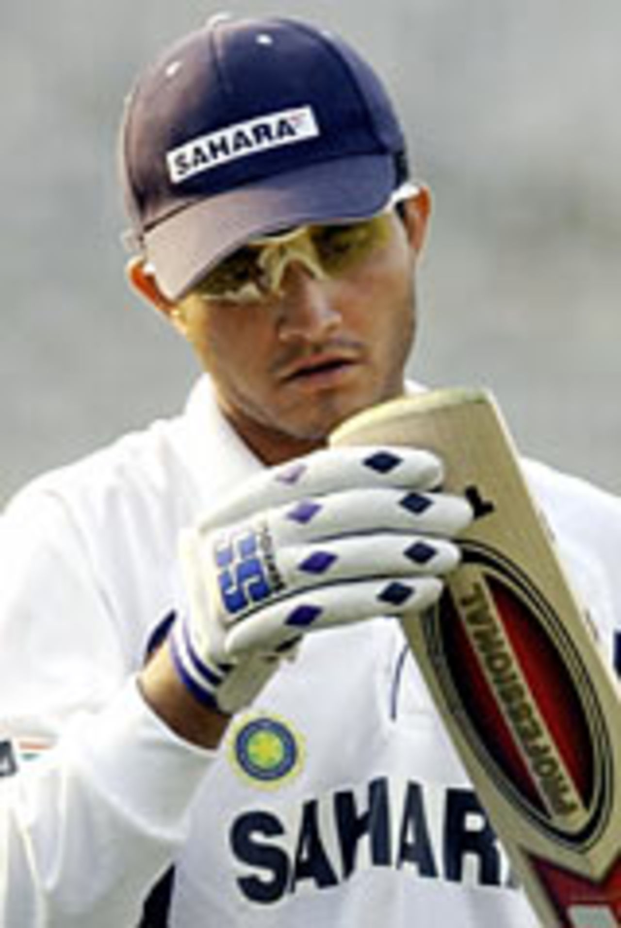 Sourav Ganguly inspects the toe of his bat during a practice session ahead of the TVS Cup final, November 17, 2003