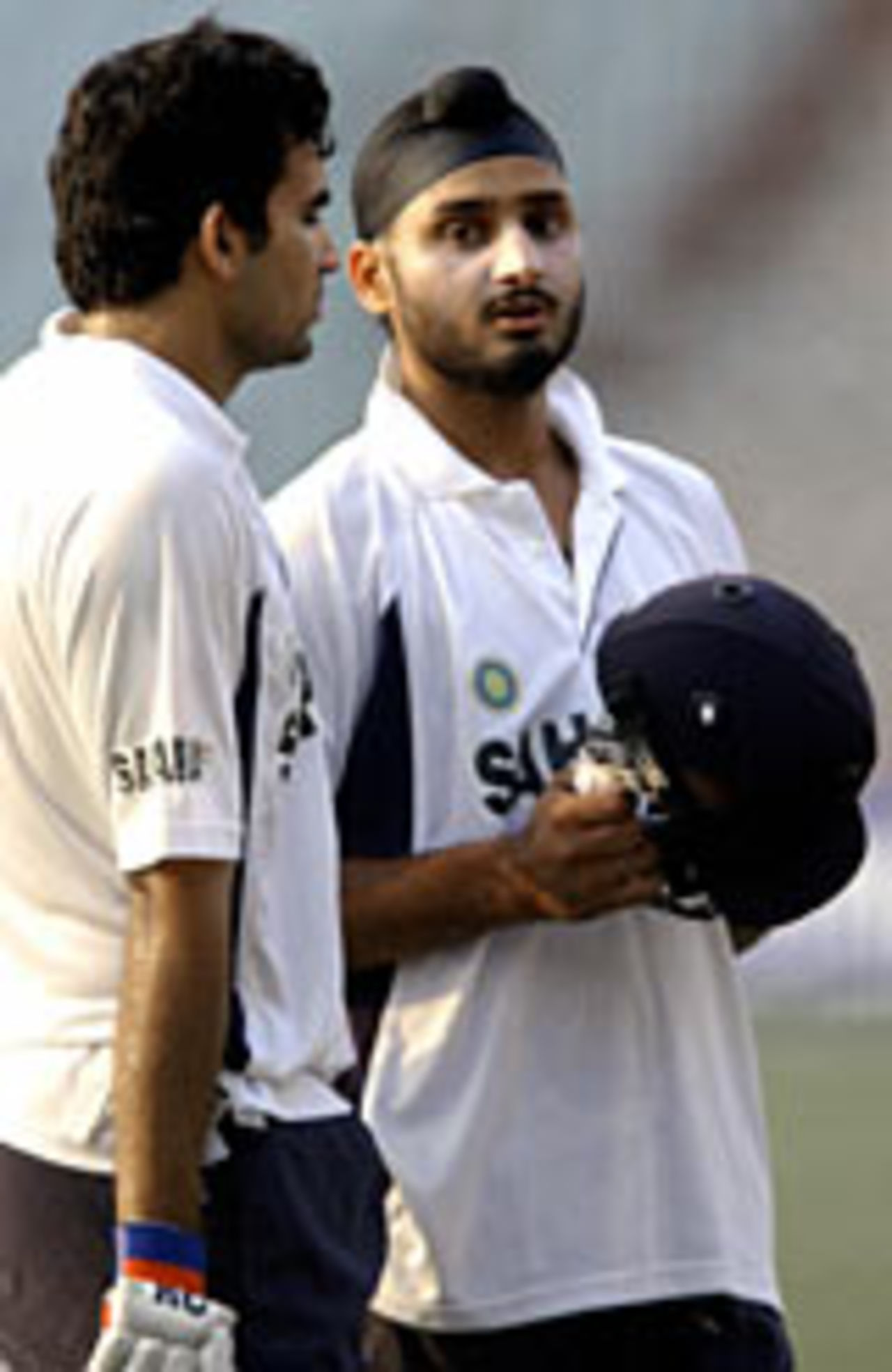 Zaheer Khan and Harbhajan Singh discuss tactics ahead of the TVS Cup final, November 17, 2003