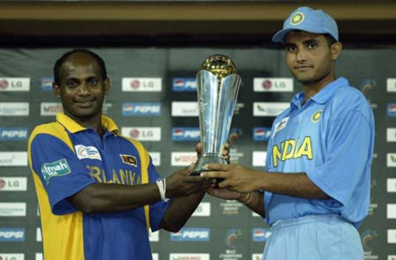 Sanath Jayasuriya of Sri Lanka and Saurav Ganguly of India share the trophy after rain stopped play during the re-scheduled ICC Champions Trophy final between Sri Lanka and India at the Premadasa Stadium in Colombo, Sri Lanka  on September 30, 2002.