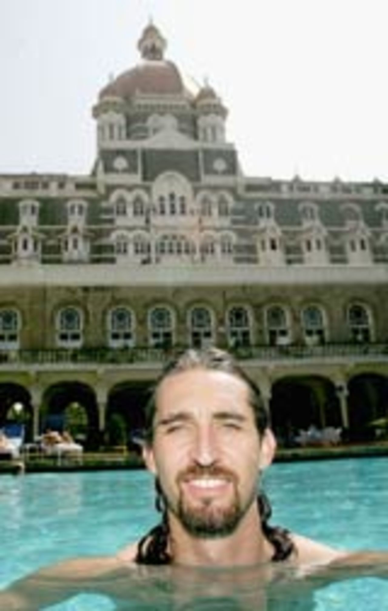 Jason Gillespie relaxes at the swimming pool in his hotel, Mumbai, November 1, 2004