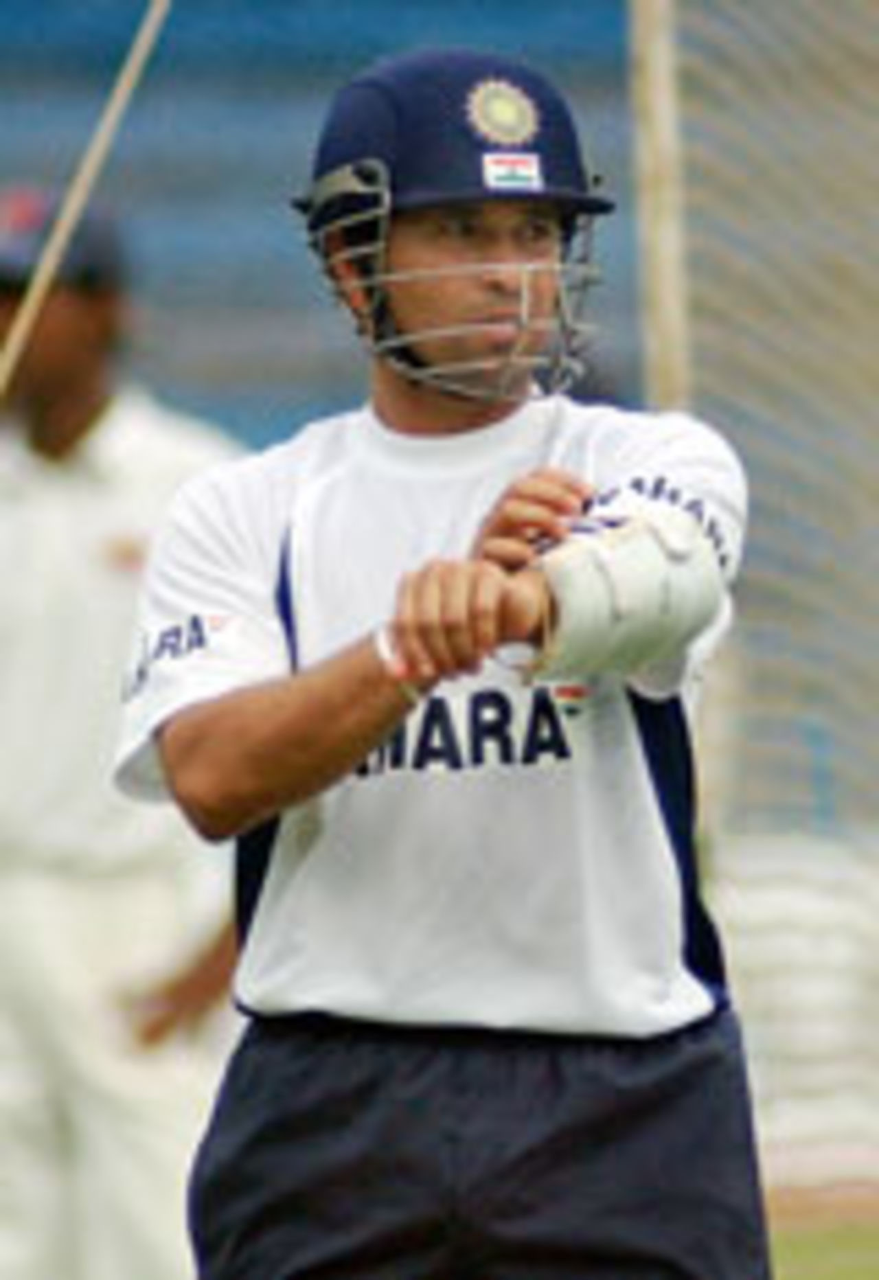 Sachin Tendulkar putting on his arm guard at practice before the fourth Test in Mumbai, November 2 2004