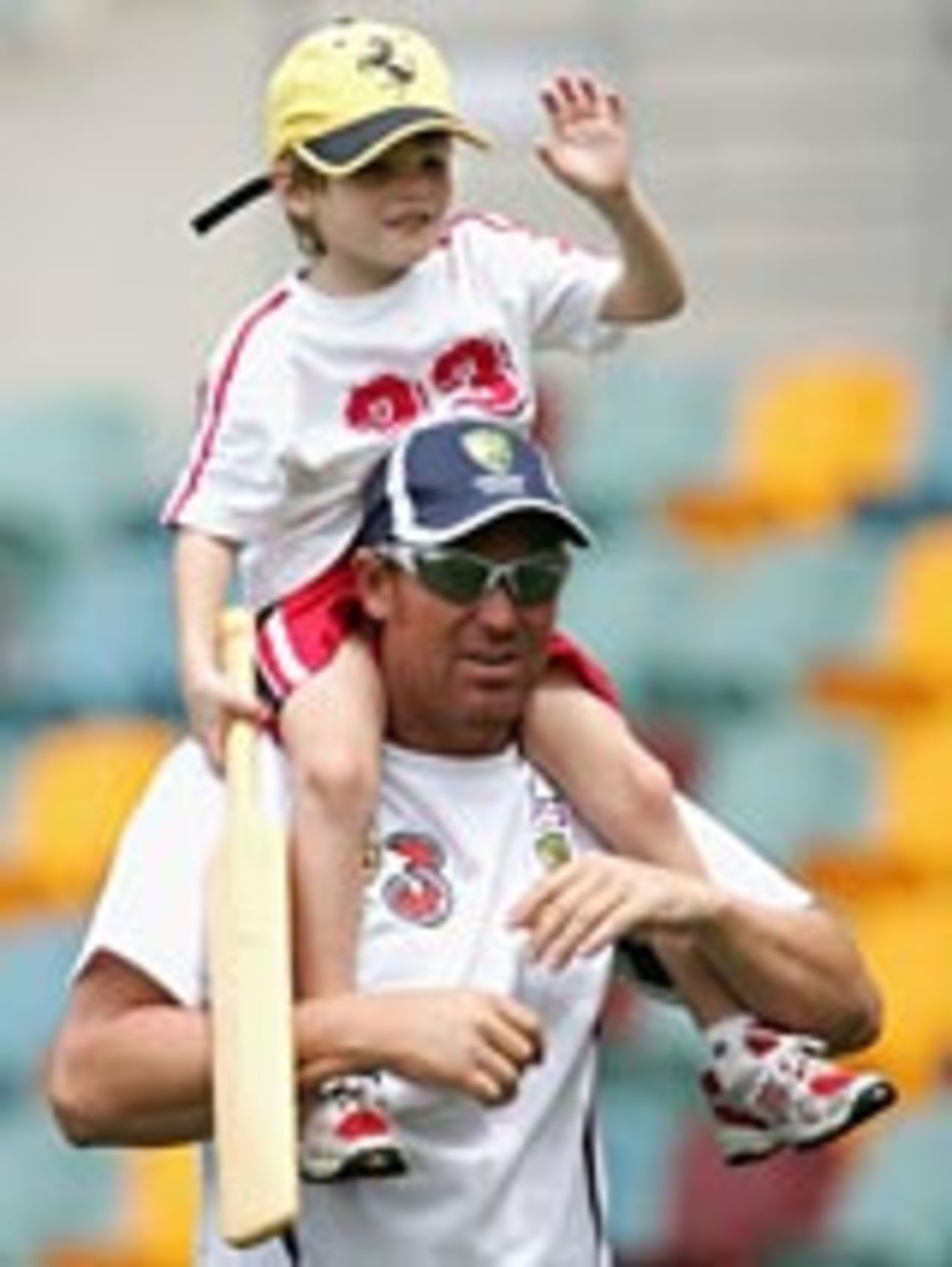 Shane Warne gives a piggyback to his son Jackson, Brisbane, November 17, 2004