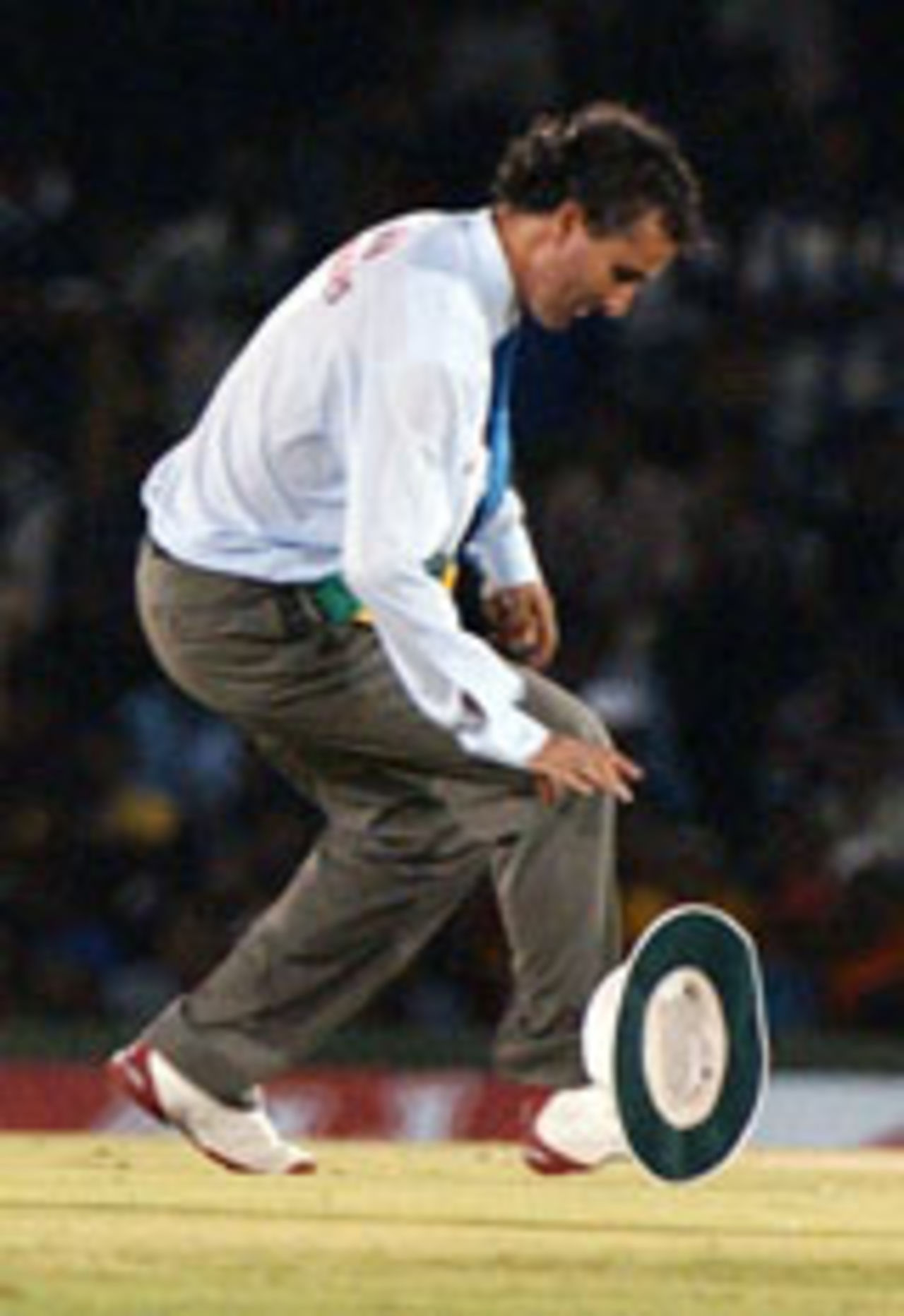 Billy Bowden chasing his hat, Sri Lanka v South Africa, 3rd ODI, Dambulla, August 25 2004