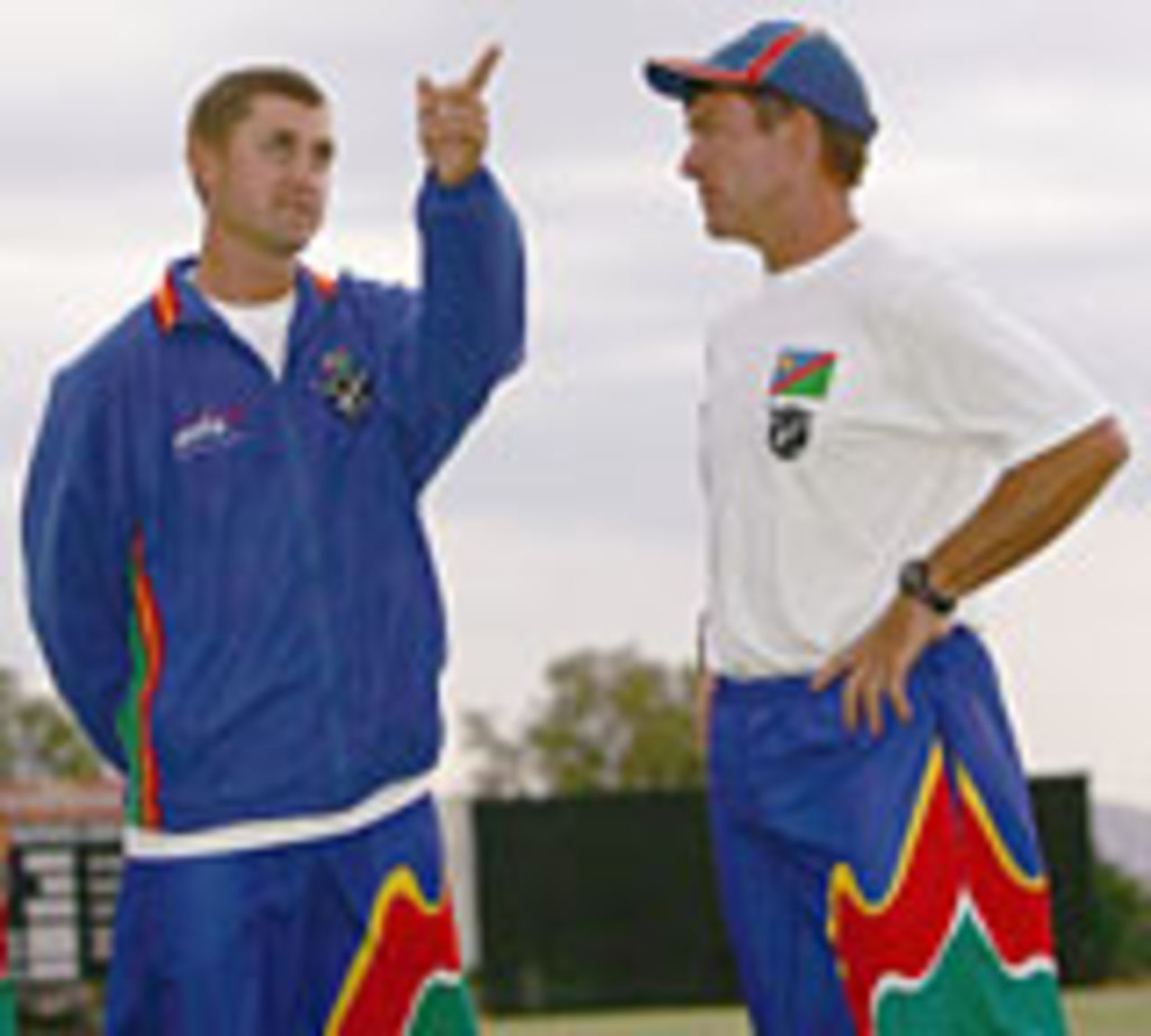 Andy Waller, Namibia's coach, chats with Deon Kotze, the captain, November 20, 2004