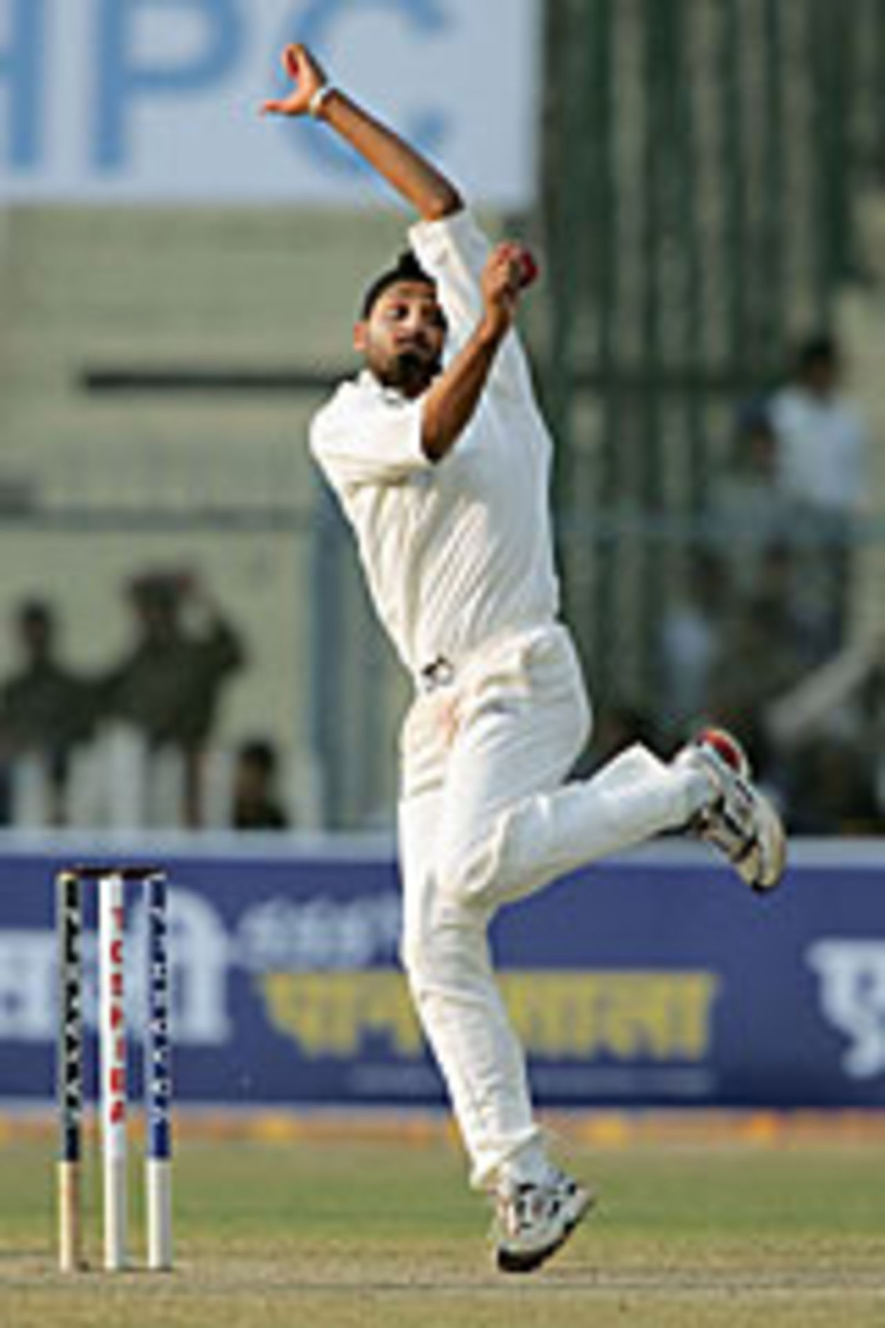 Harbhajan Singh bowling on the first day of the first Test against South Africa at Kanpur, November 20 2004