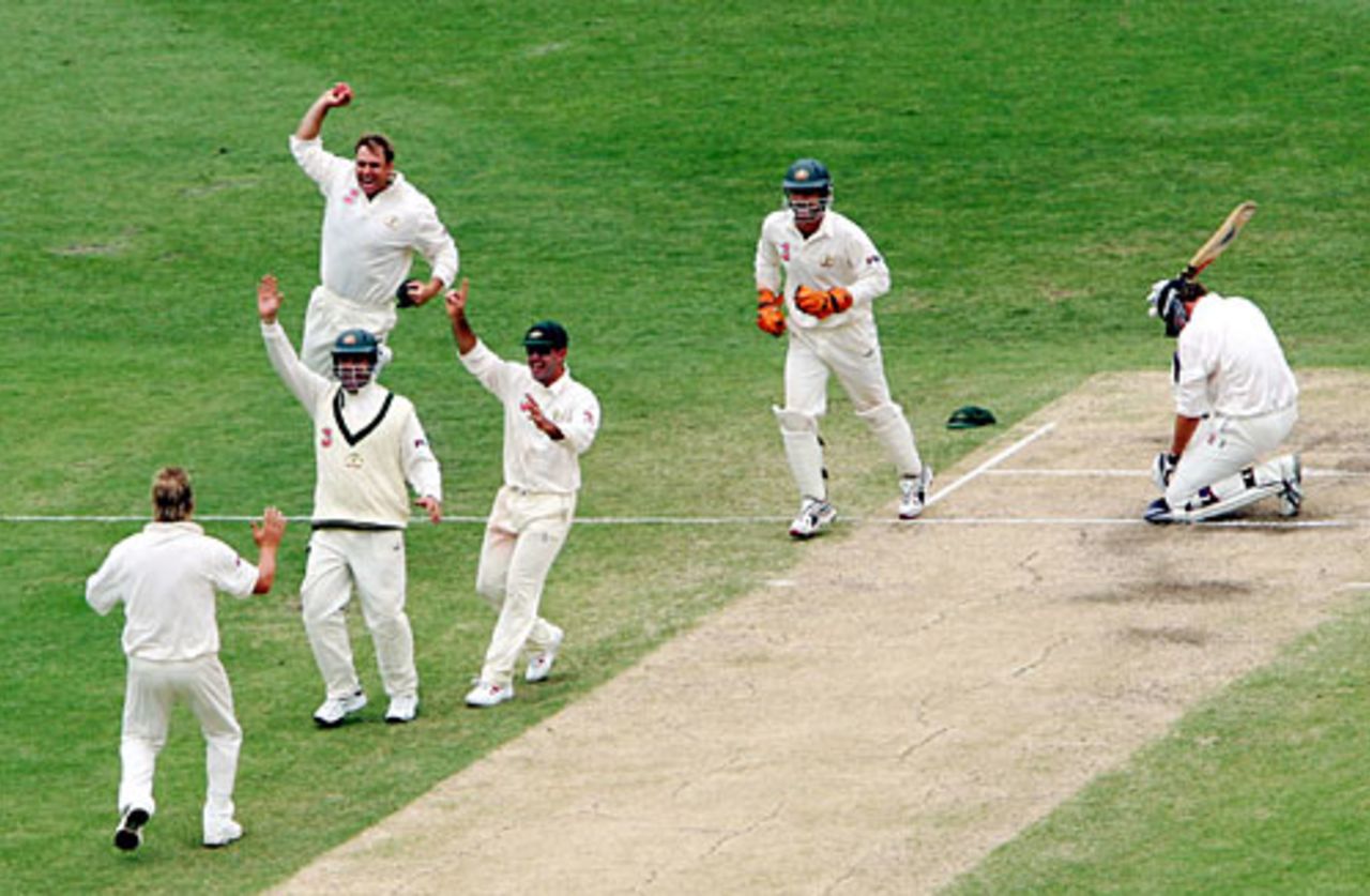 Shane Warne celebrates after Jacob Oram's freak dismissal, caught off the back of his bat,  Australia v New Zealand, 1st Test, Brisbane, November 21, 2004