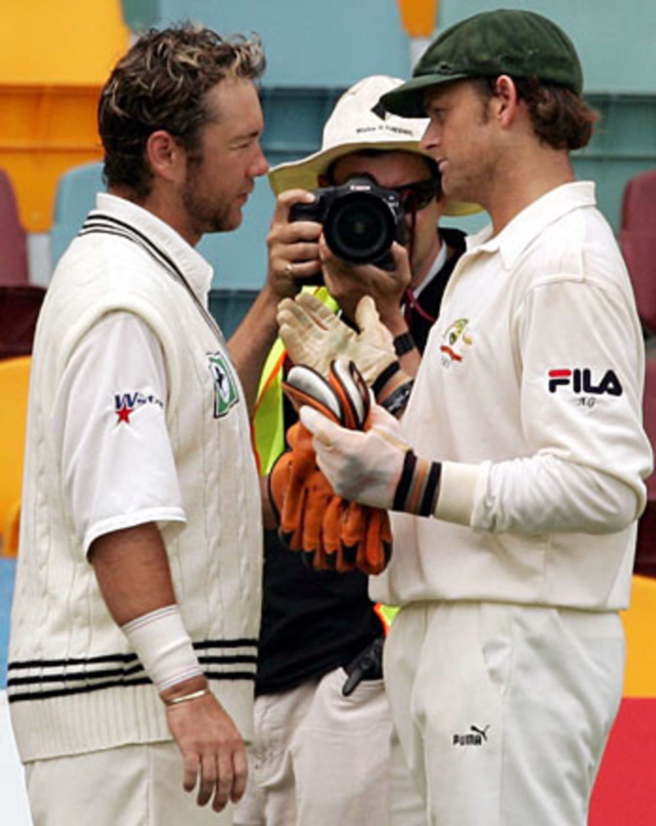 Craig McMillan and Adam Gilchrist exchange post-match views - the pair clashed during the day, Australia v New Zealand, 1st Test, Brisbane, November 21, 2004