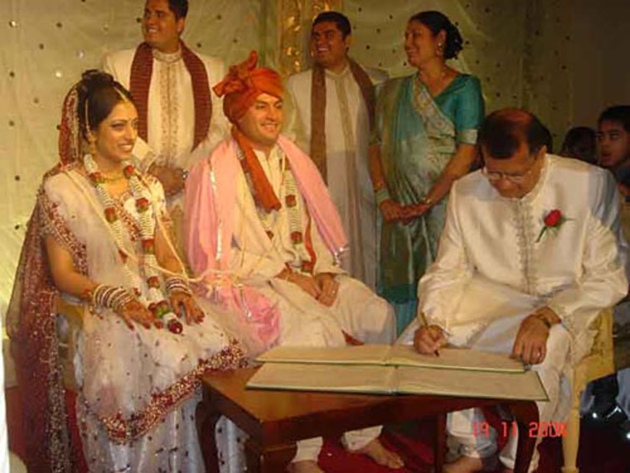 Hitesh Modi's wedding - Rear Left to right: Two brothers Nimesh and Dipesh, and mother Arunaben. Front left to right: Sharmilee, Hitesh and father Subhashbhai signing the marriage book.