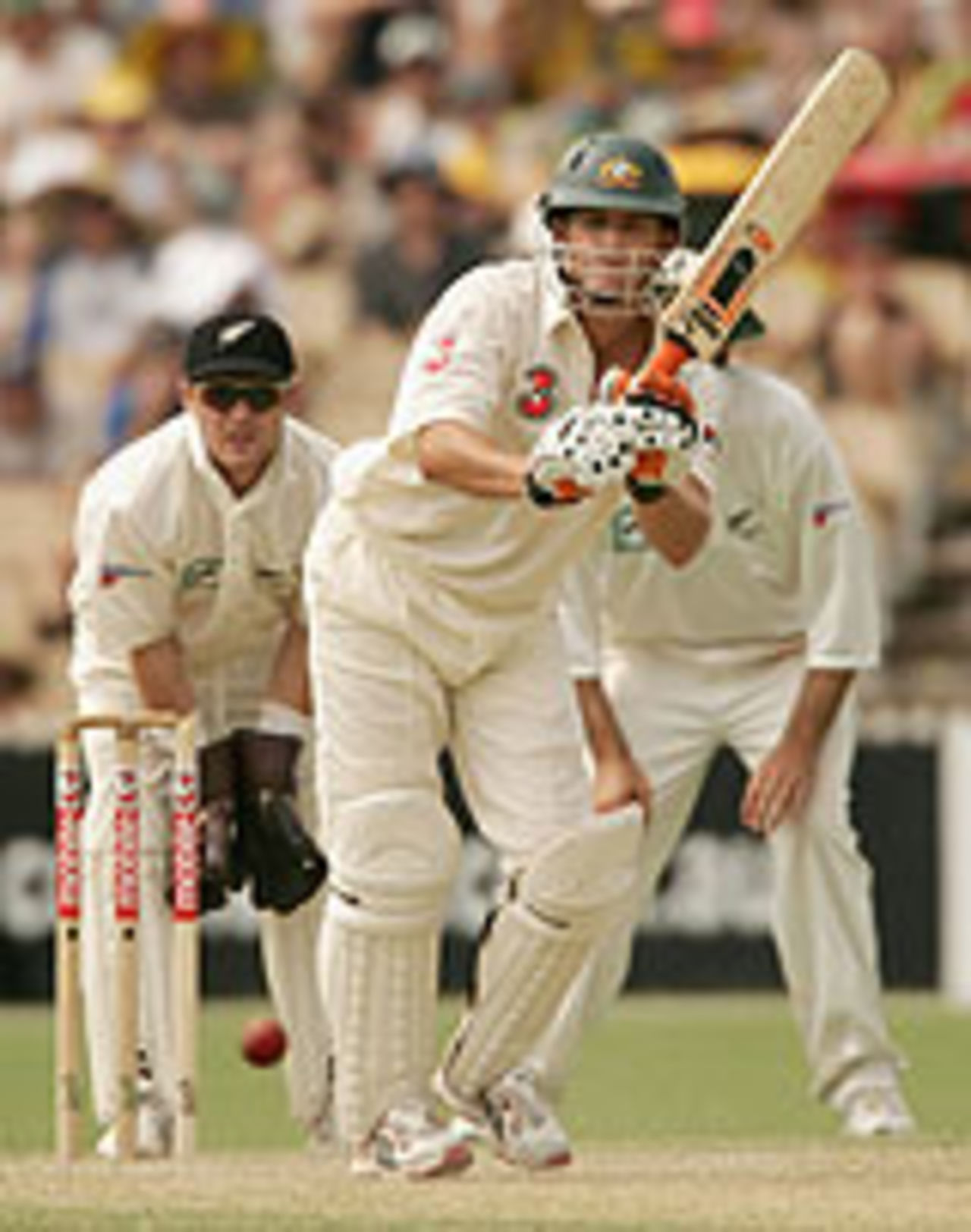 Adam Gilchrist drives down the ground, during his half-century on the second day of the Adelaide Test, Australia v New Zealand, 2nd Test, Adelaide, November 27, 2004