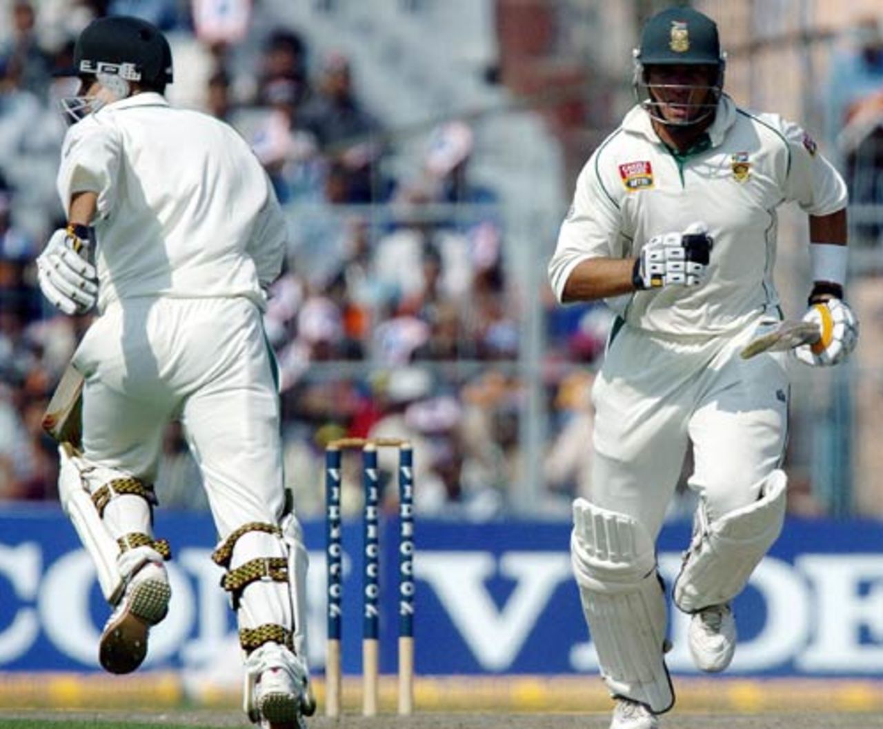 The two Jacques, Kallis and Rudolph, steal a run during their 109-run partnership on the first day of the Kolkata Test against India, November 28, 2004