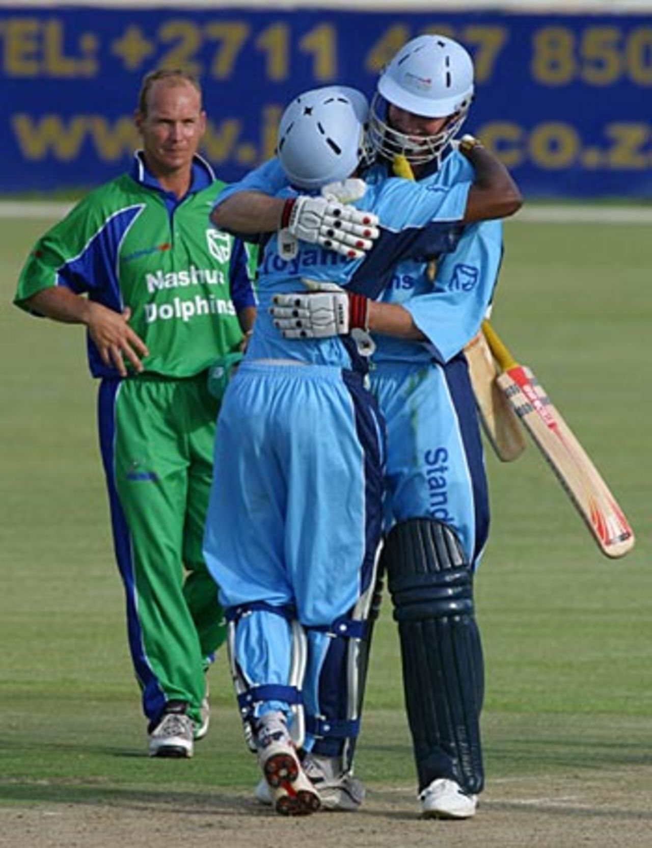 Gerald Dros and Geoffrey Toyana celebrate victory, Titans v Dolphins, Standard Bank Cup, Willowmoore Park, November 28, 2004