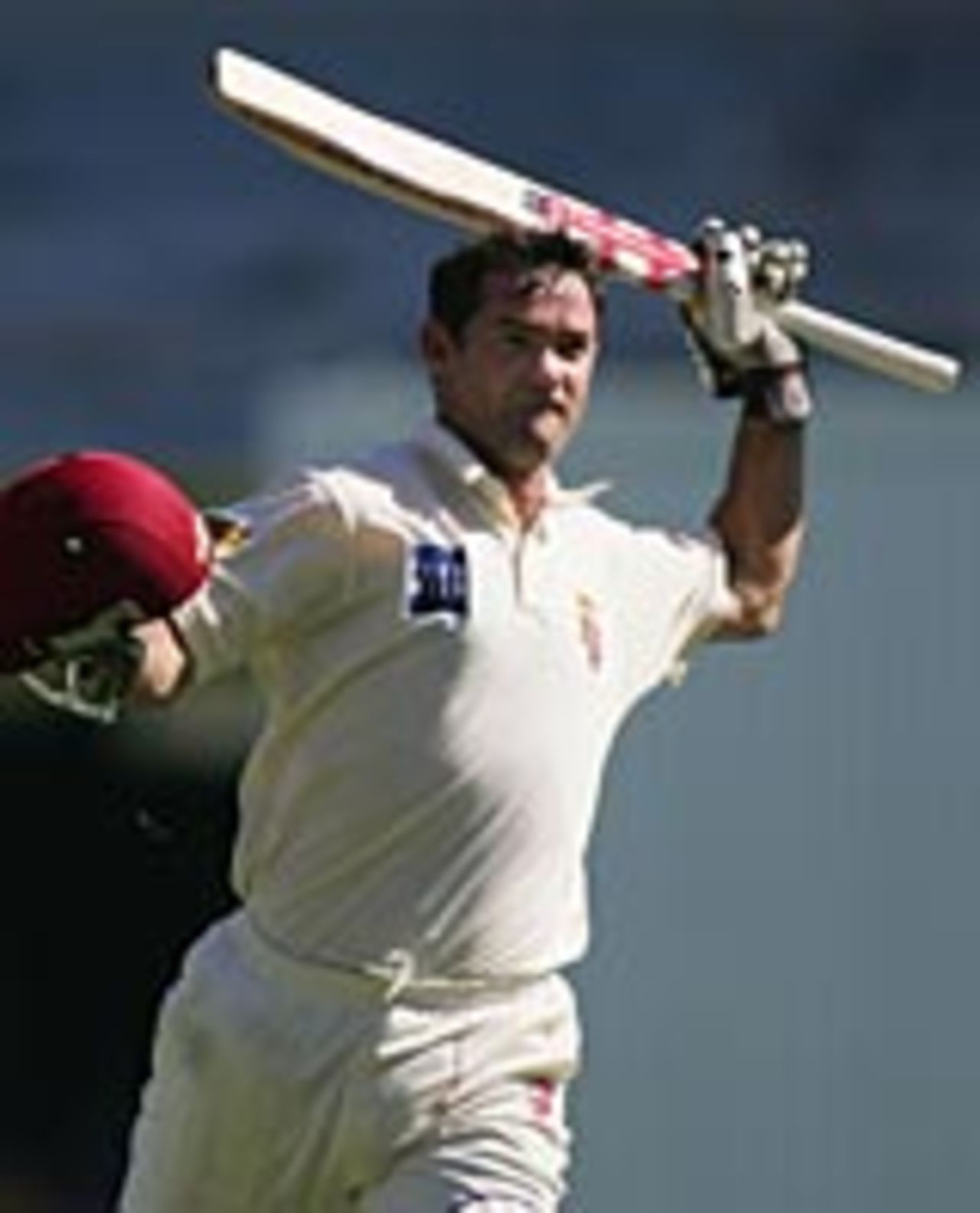 Jimmy Maher celebrates his hundred, Queensland v Tasmania, Brisbane, November 29, 2004
