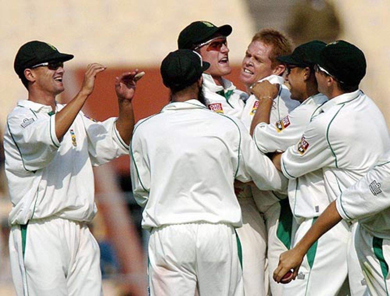 Shaun Pollock is congratulated by his team-mates after he got rid of Gautam Gambhir, India v South Africa, 2nd Test, Kolkata, 2nd day, November 29, 2004