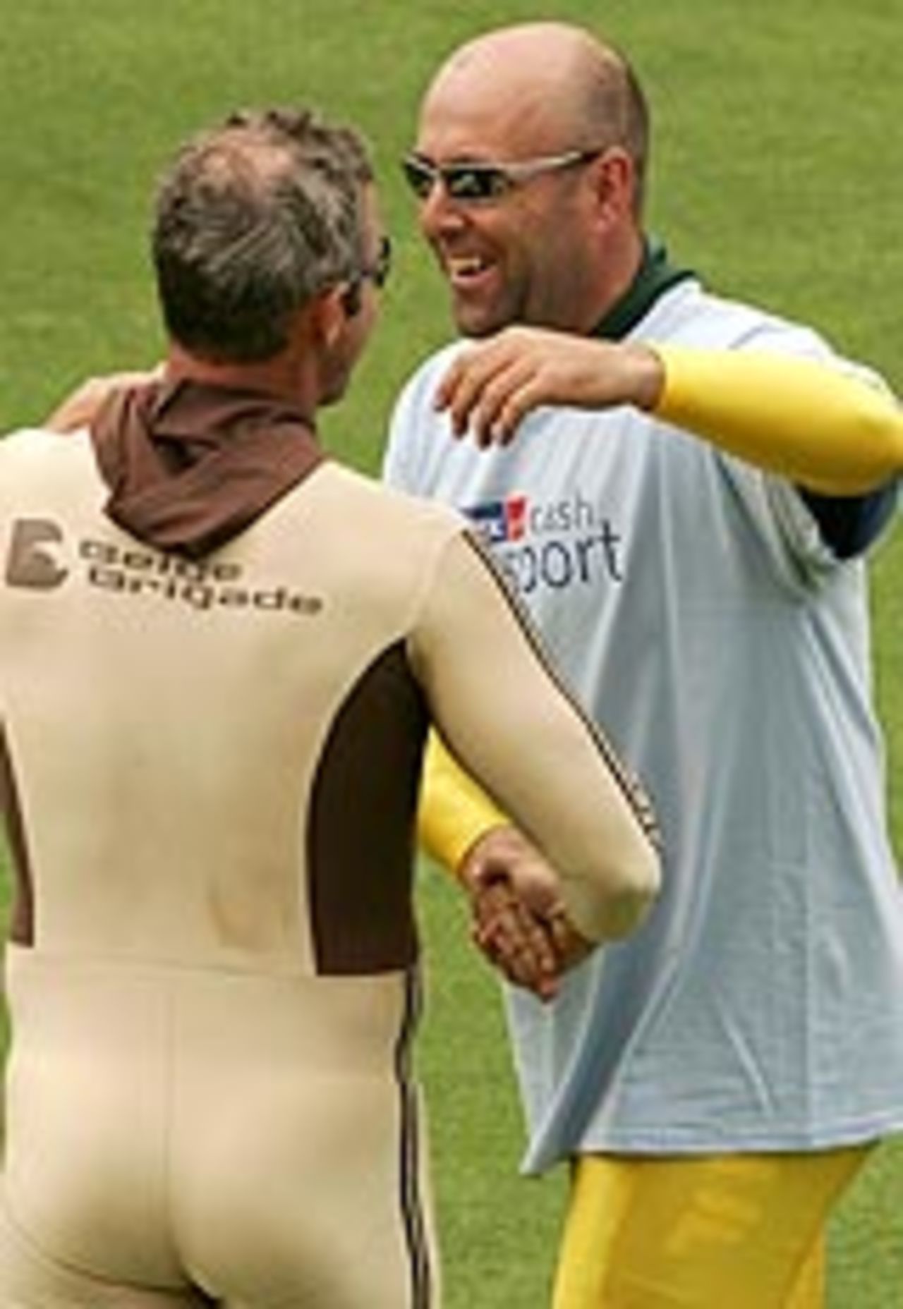 Mark Richardson and Darren Lehmann embrace after their sprint race, Australia v New Zealand, 2nd Test, Adelaide, November 30, 2004