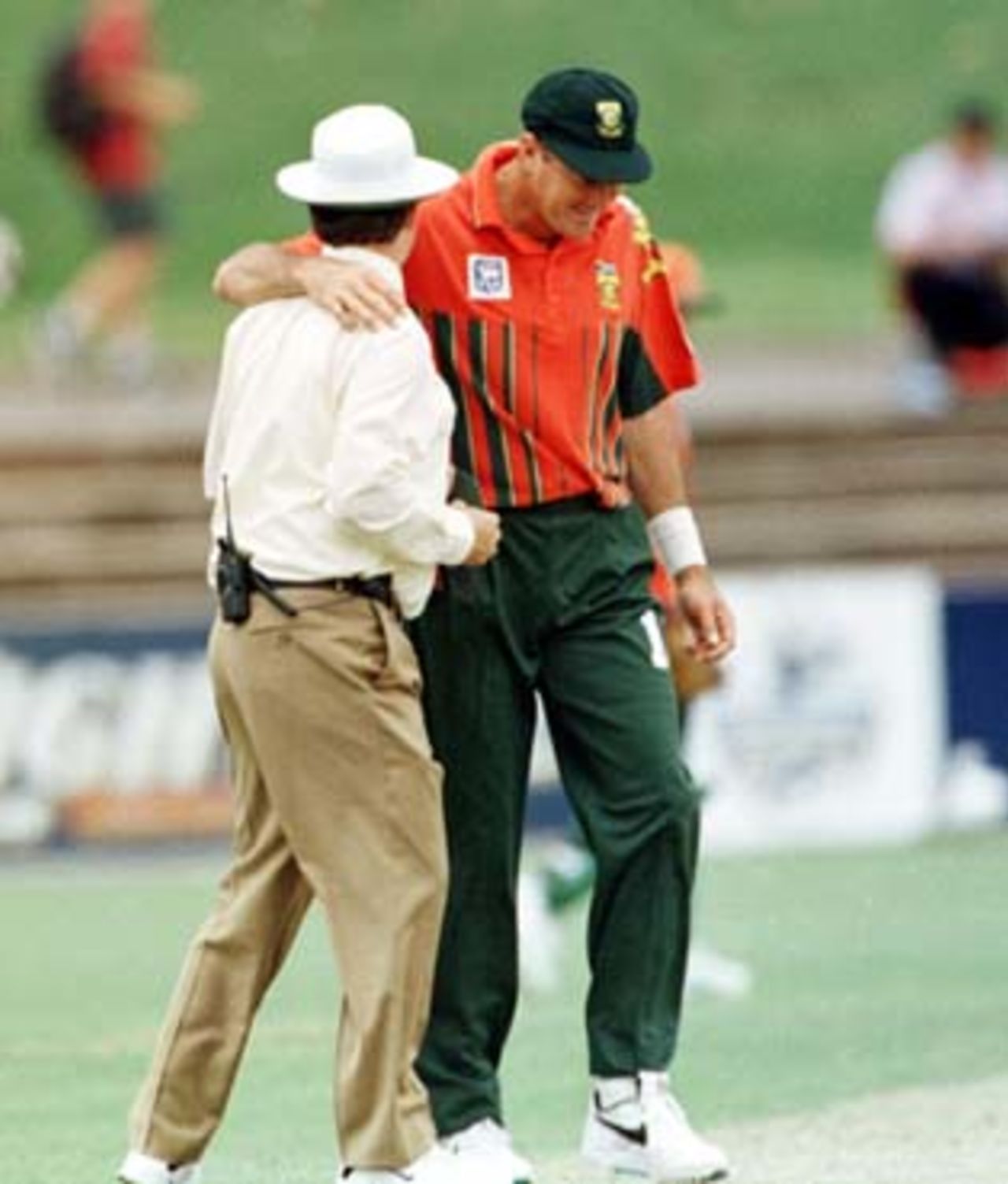 Pat Symcox cuddles umpire Emerson after his confrontation with Cronje ...South Africa v New Zealand ODI, at the Adelaide Oval, Saturday December 6th 1997.