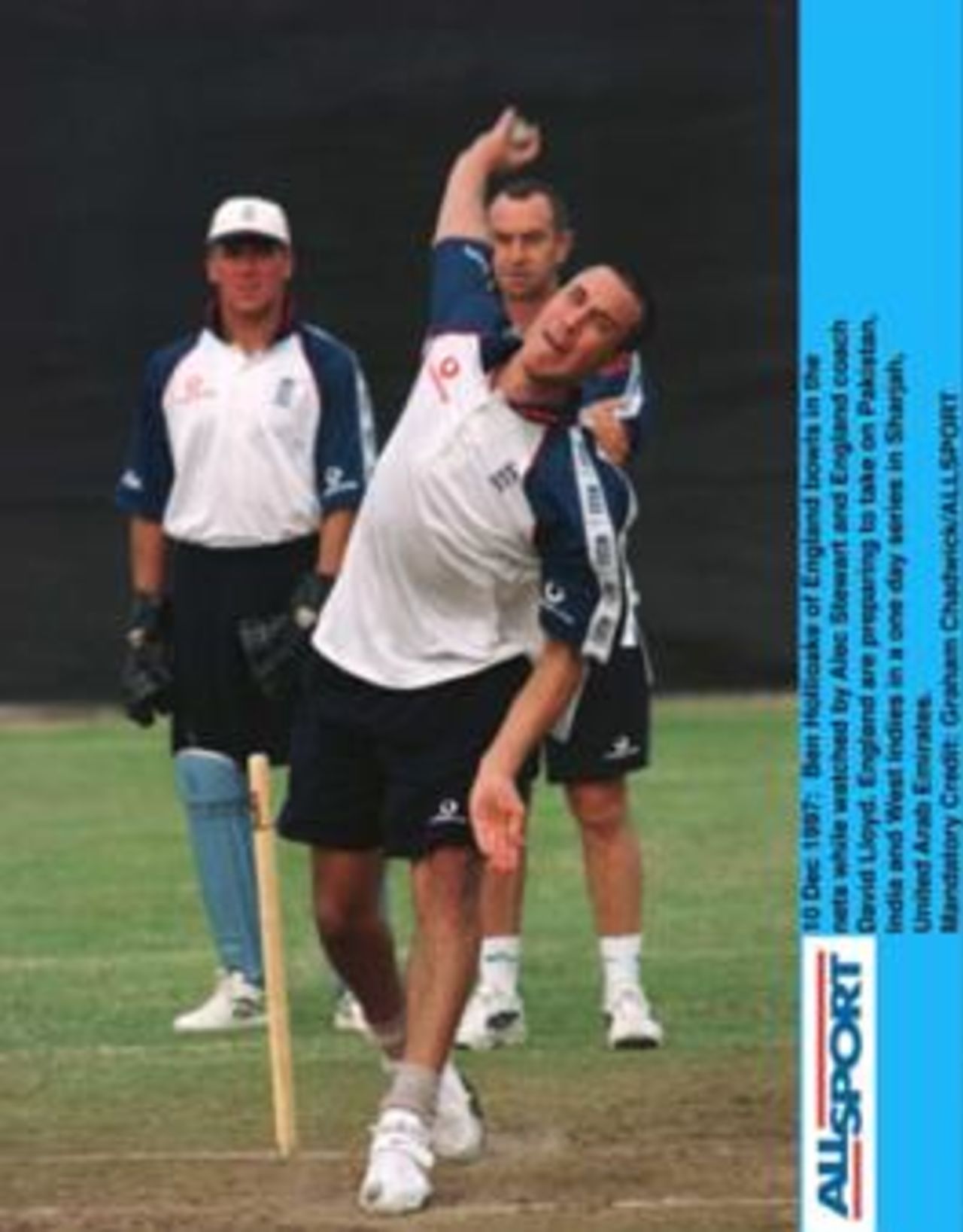 England's Ben Hollioake bowls in the nets watched by Alec Stewart and England coach David Lloyd, on the eve of the first match of the Champions Trophy in Sharjah.