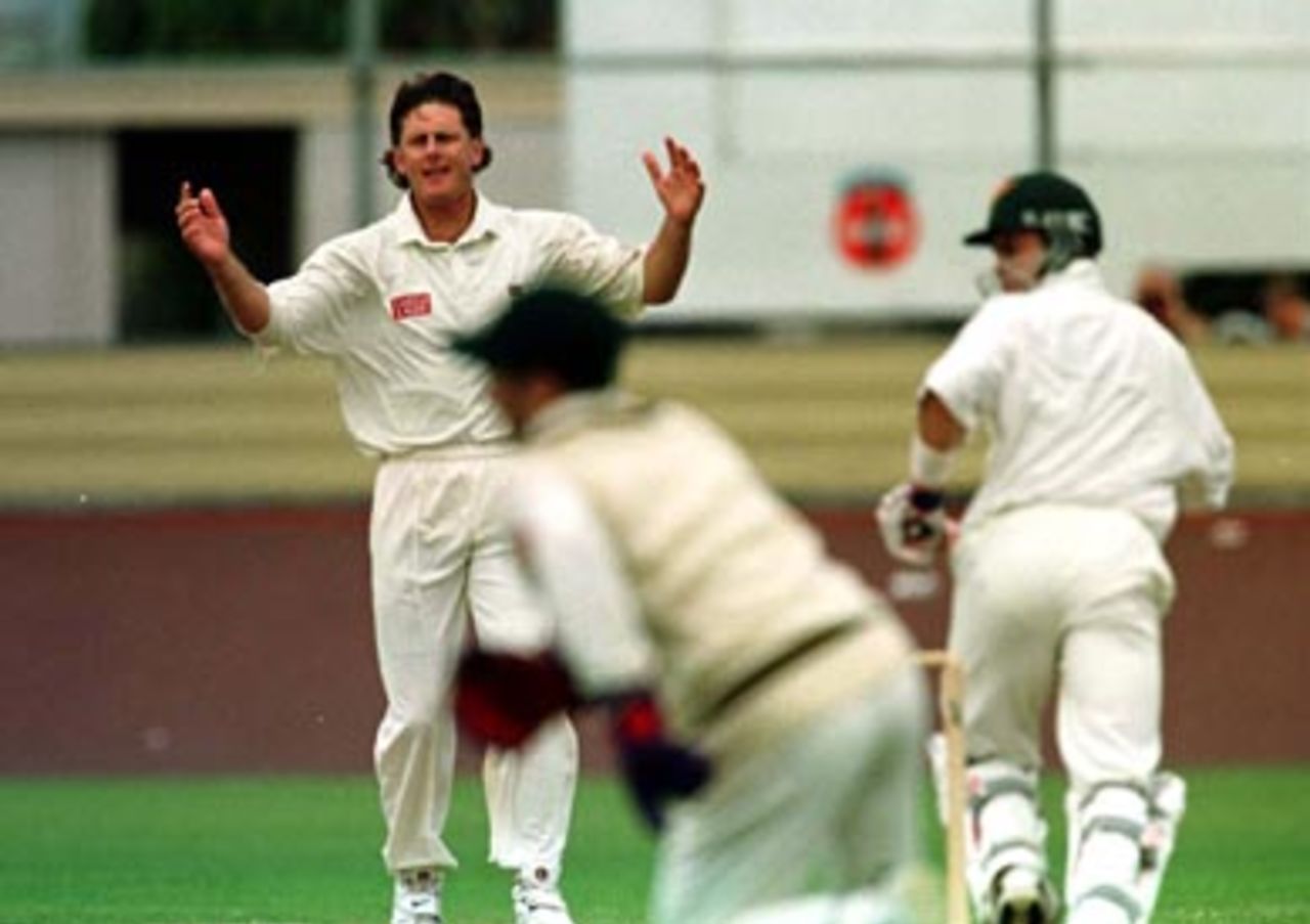 Brian McMillan's hands go up as a half chance goes to ground .. during the first day of the match against Tasmania in Devonport, Tasmania, Saturday December 13th 1997.