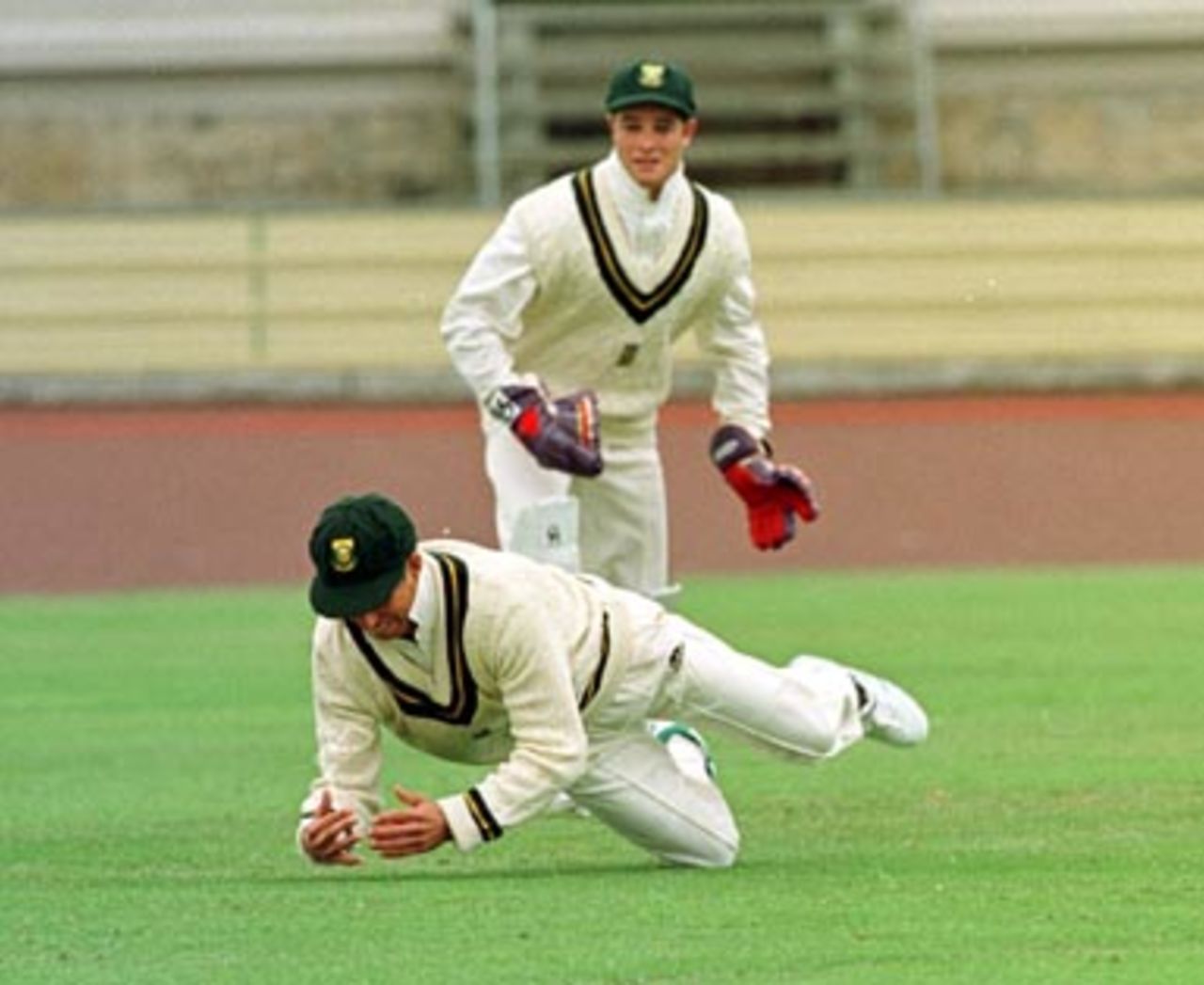 Senior wicketkeeper, Dave Richardson, on the field as a one over replacement for Cronje, drops Atkinson off Kallis as junior 'keeper Boucher looks on..... South Africans v Tasmania, Day 4, December 16th 1997.