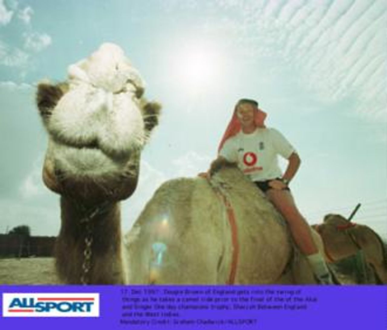 Dougie Brown riding on a camel prior to the final of the Champions Trophy in Sharjah between England and West Indies