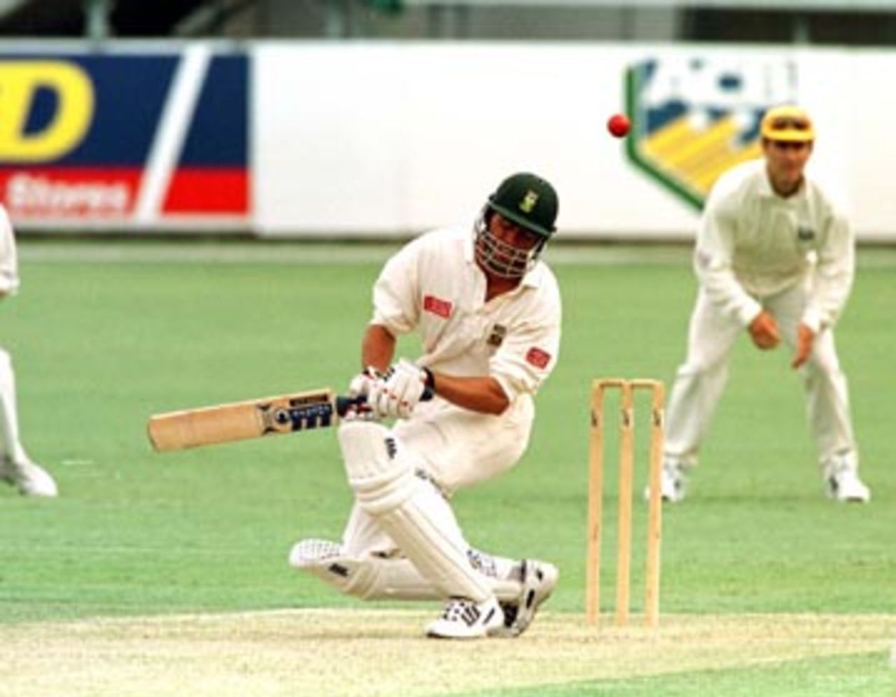 Hansie Cronje ducks under a Brett Lee bouncer during the first day of the Australia 'A' v South Africans 4 day match at the Gabba in Brisbane. December 19th 1997.