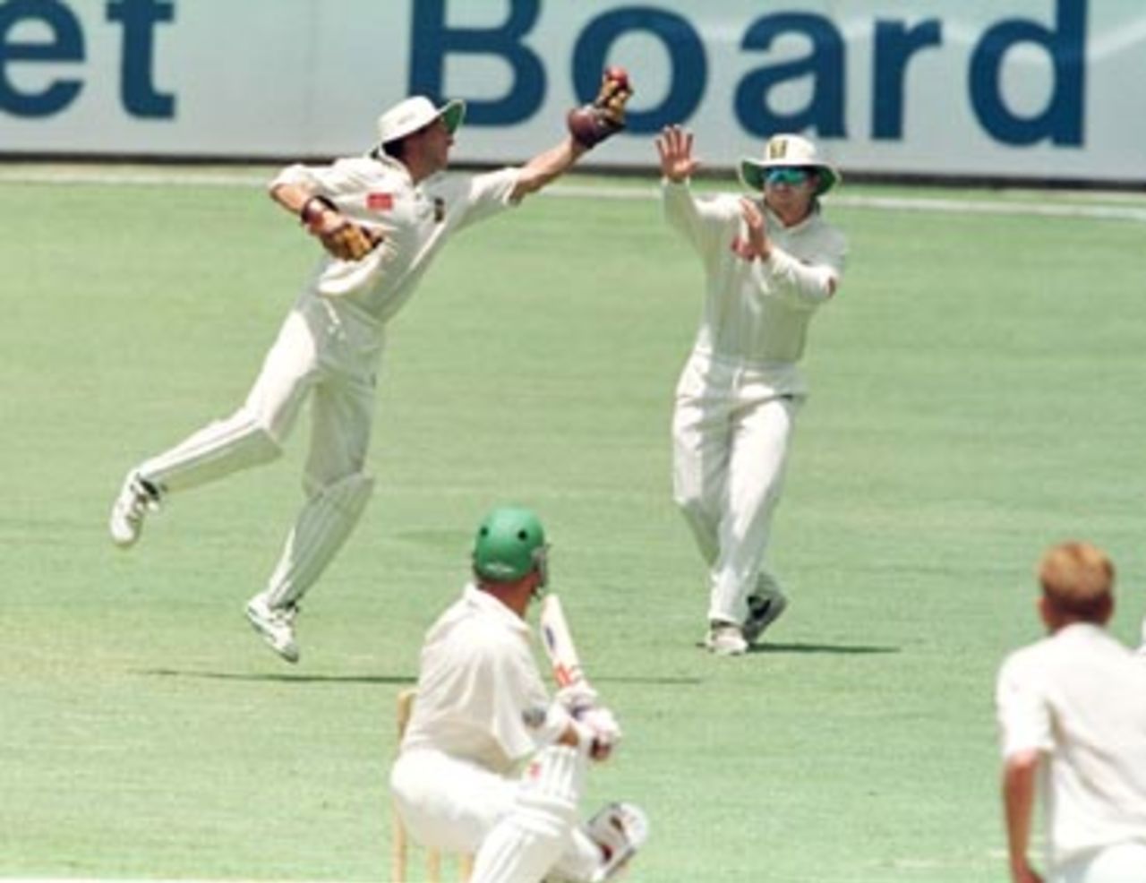 Dave Richardson reaches after a Sean Pollock highball during the 3rd day of the Australia 'A' v South Africans 4 day match at the Gabba in Brisbane. December 21st 1997.