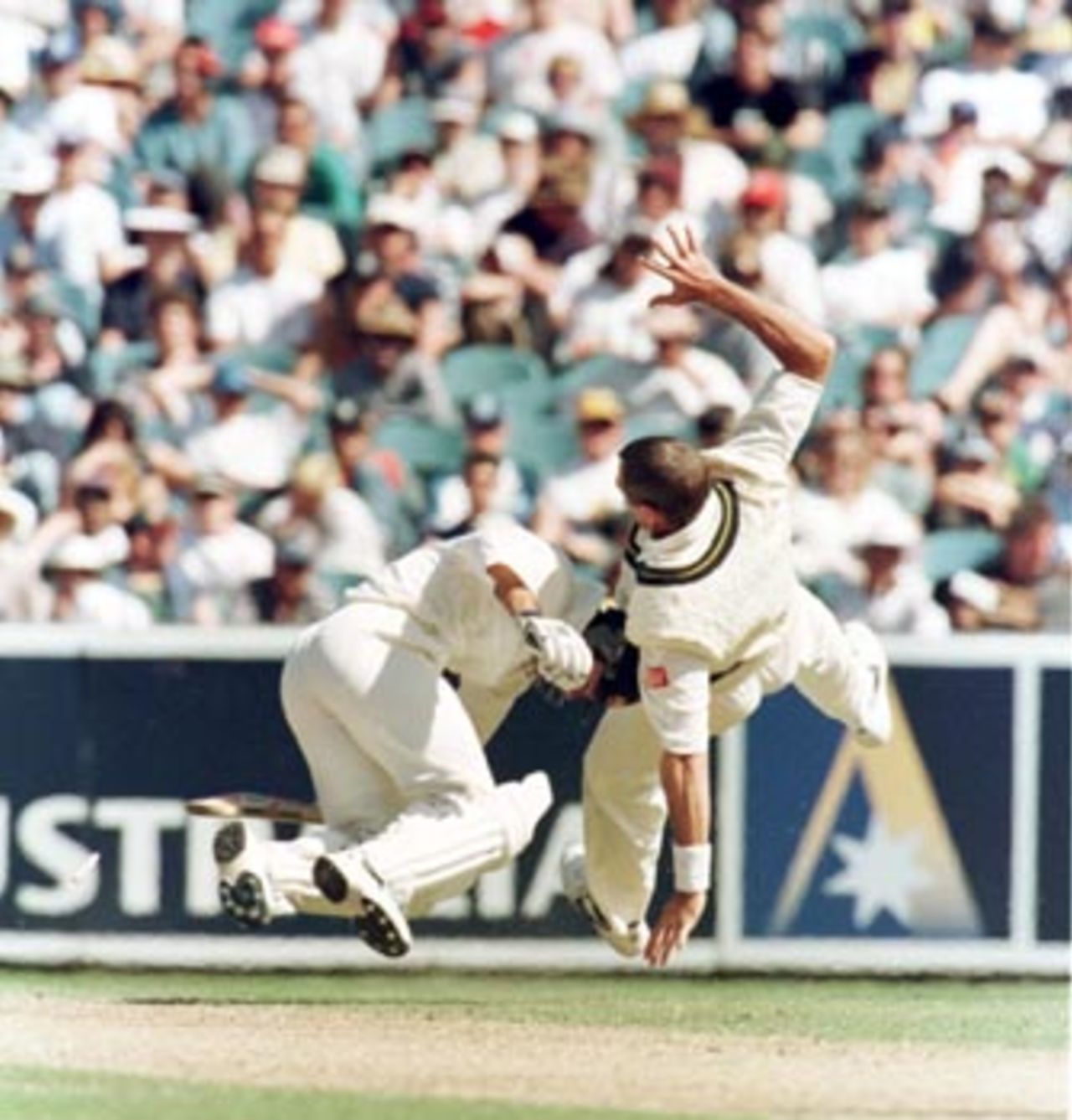 Ricky Ponting and Pat Symcox collide during the 1st day of the 1st Test between Australia and South Africa at the MCG. December 26th 1997.