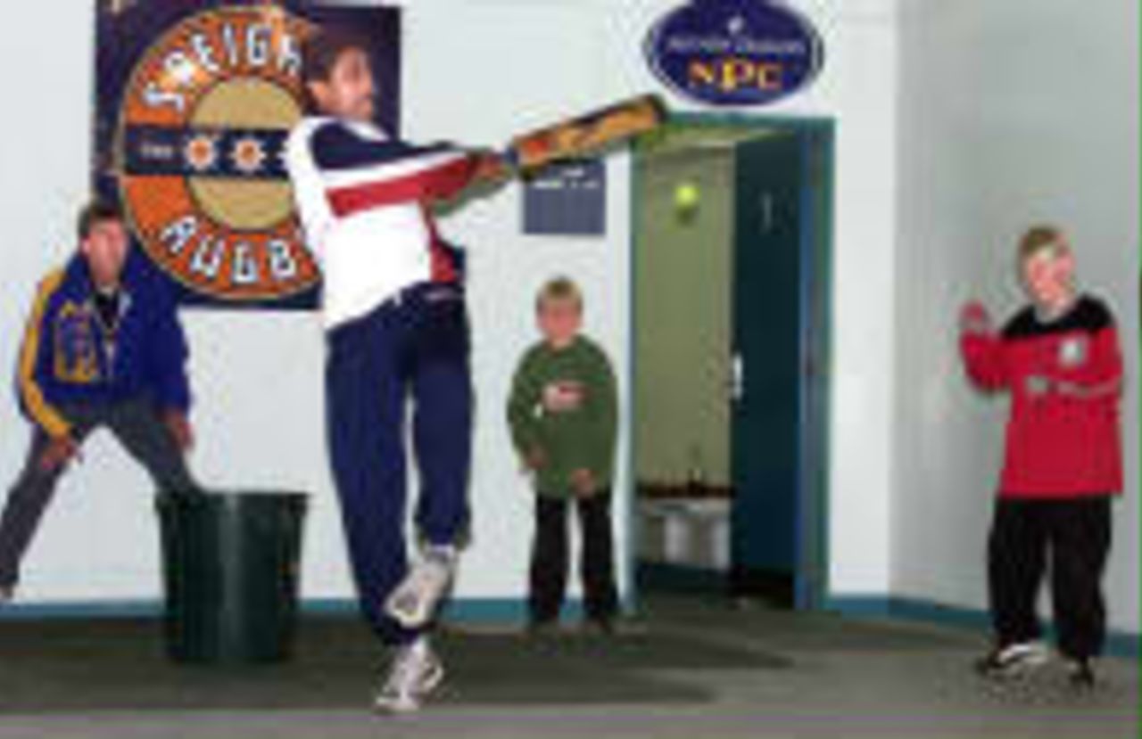 Kumble hooks a ball while playing indoor cricket with the local children after the washout of the first day India in New Zealand, 1998/99, 1st Test New Zealand v India Carisbrook, Dunedin 18 December 1998